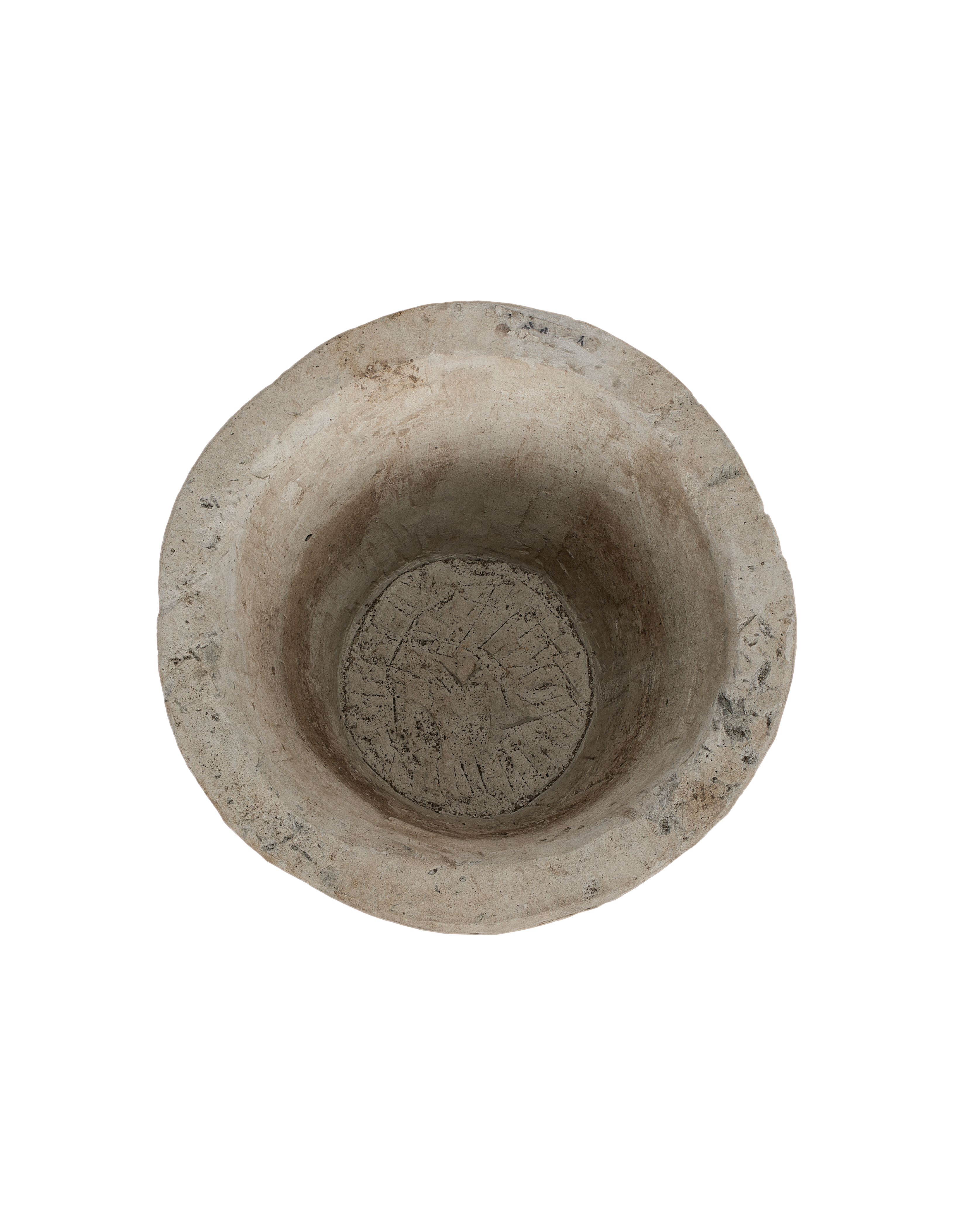 Vintage Indonesian round limestone trough, showing weathered interior base with etched pattern from above.