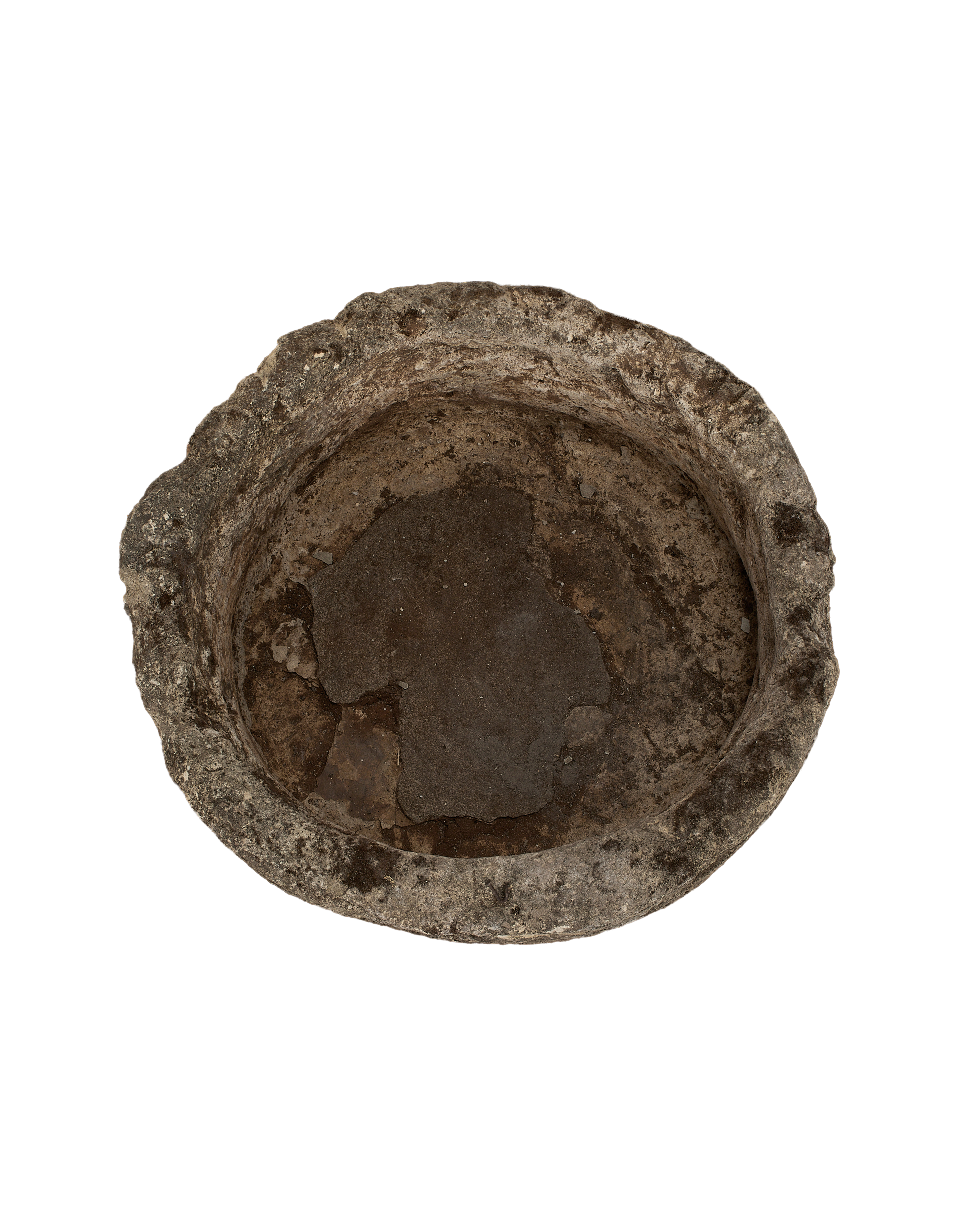 Top-down view of vintage round Indonesian limestone trough showing weathered interior.