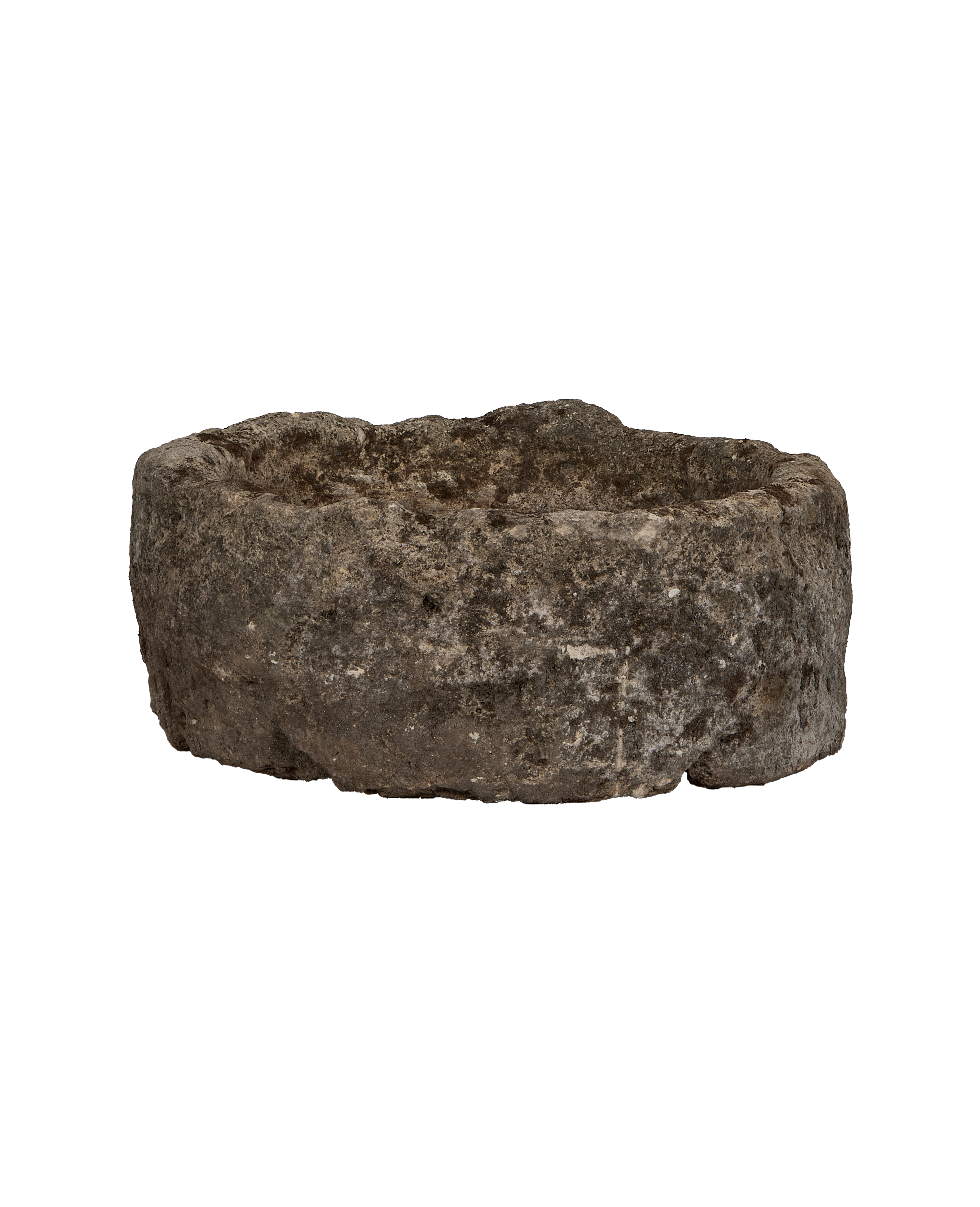 Vintage Indonesian round limestone trough, showing a rugged, weathered exterior texture.