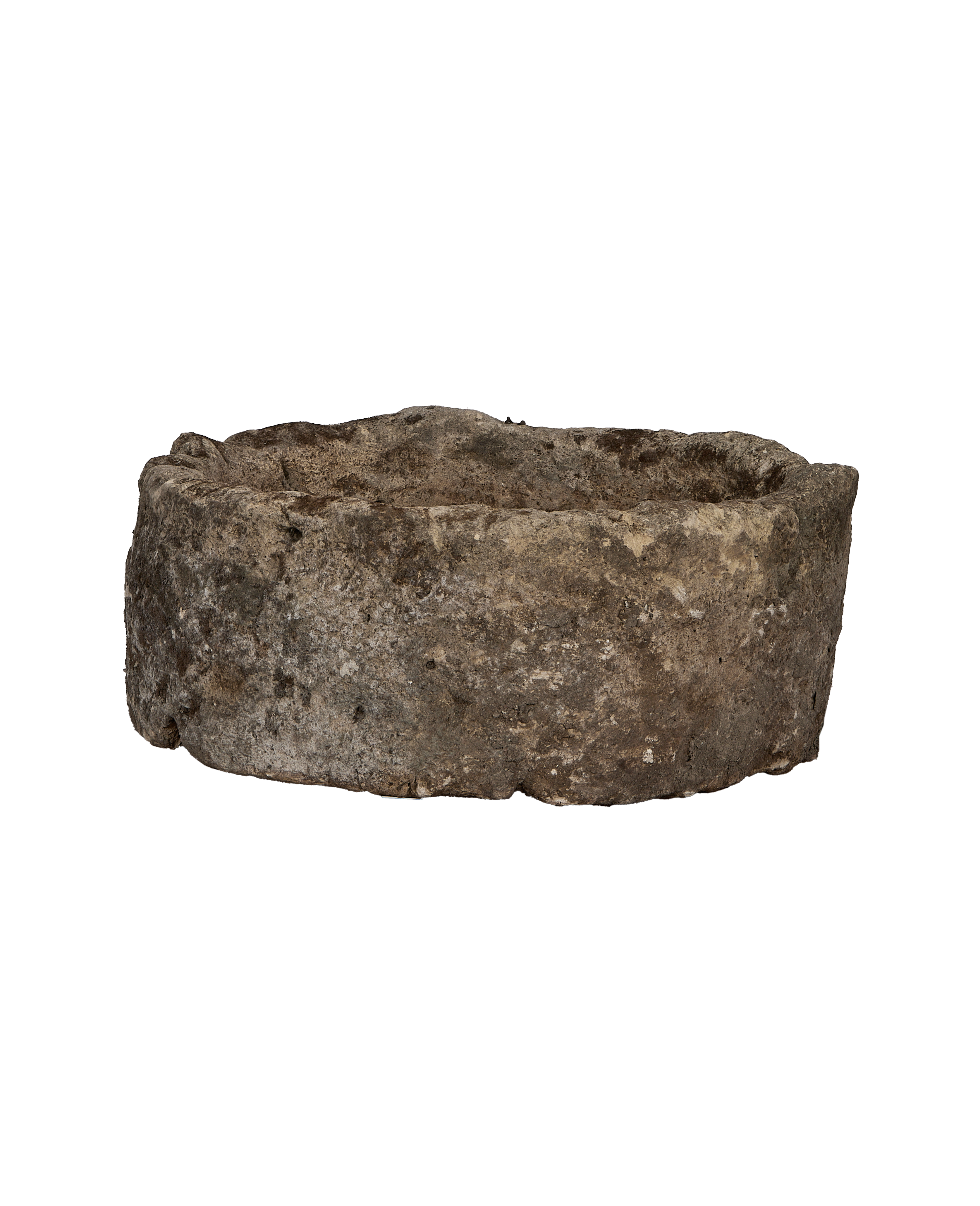 Vintage Indonesian round limestone trough, close-up of textured outer surface.