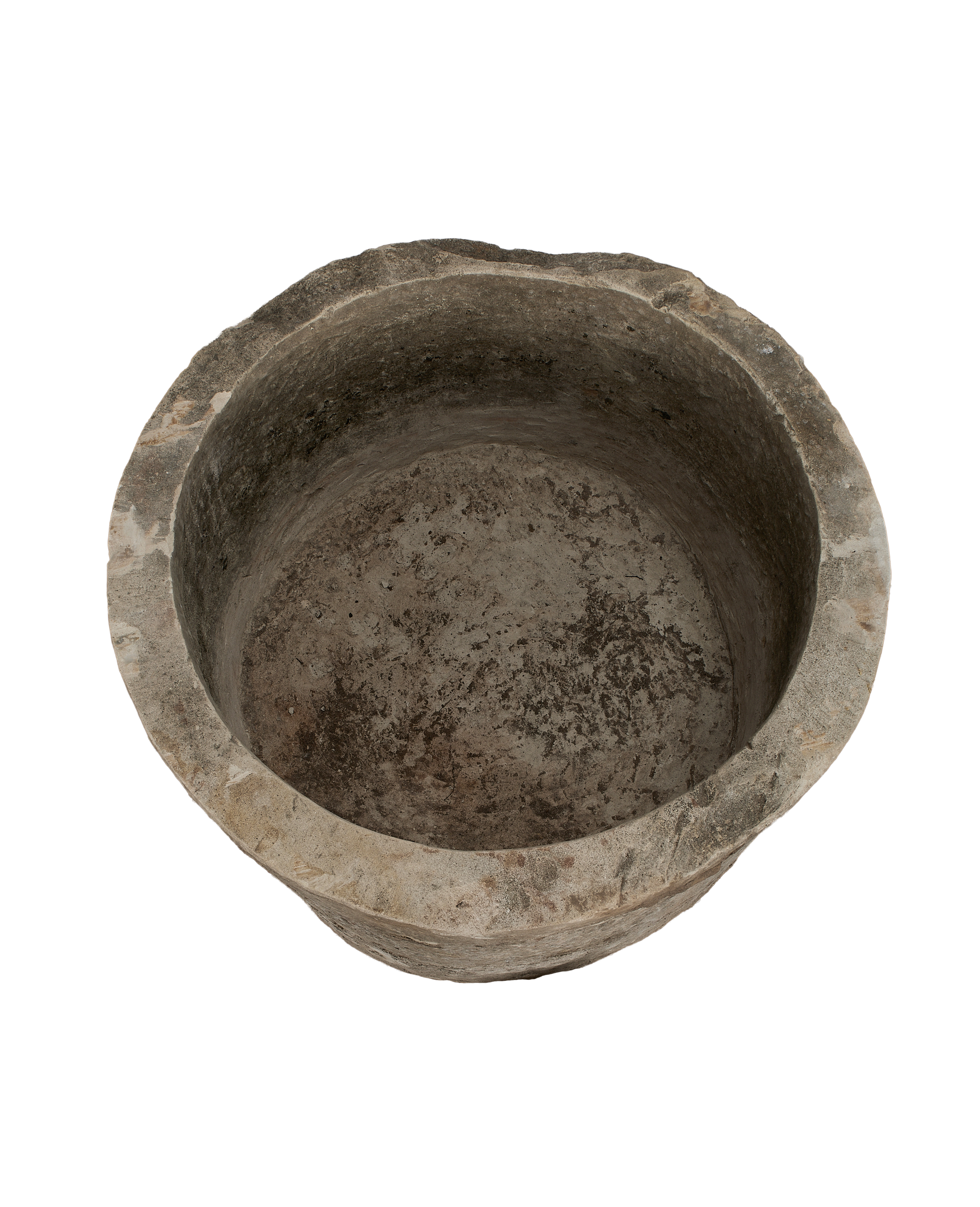 Vintage Indonesian round limestone trough, top-down view showing interior texture and worn rim.