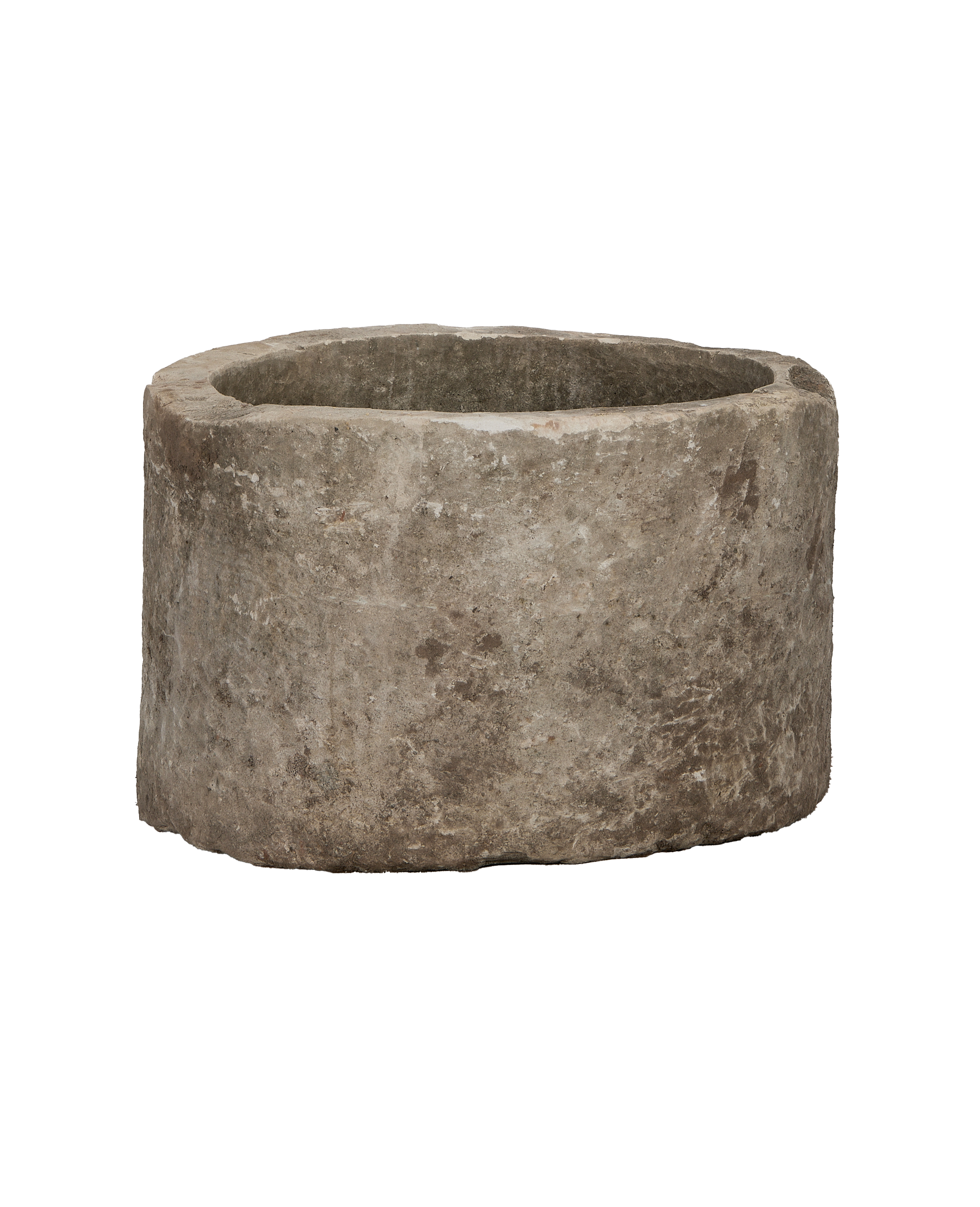 Vintage Indonesian round limestone trough, showing its aged, weathered texture and rustic rim.