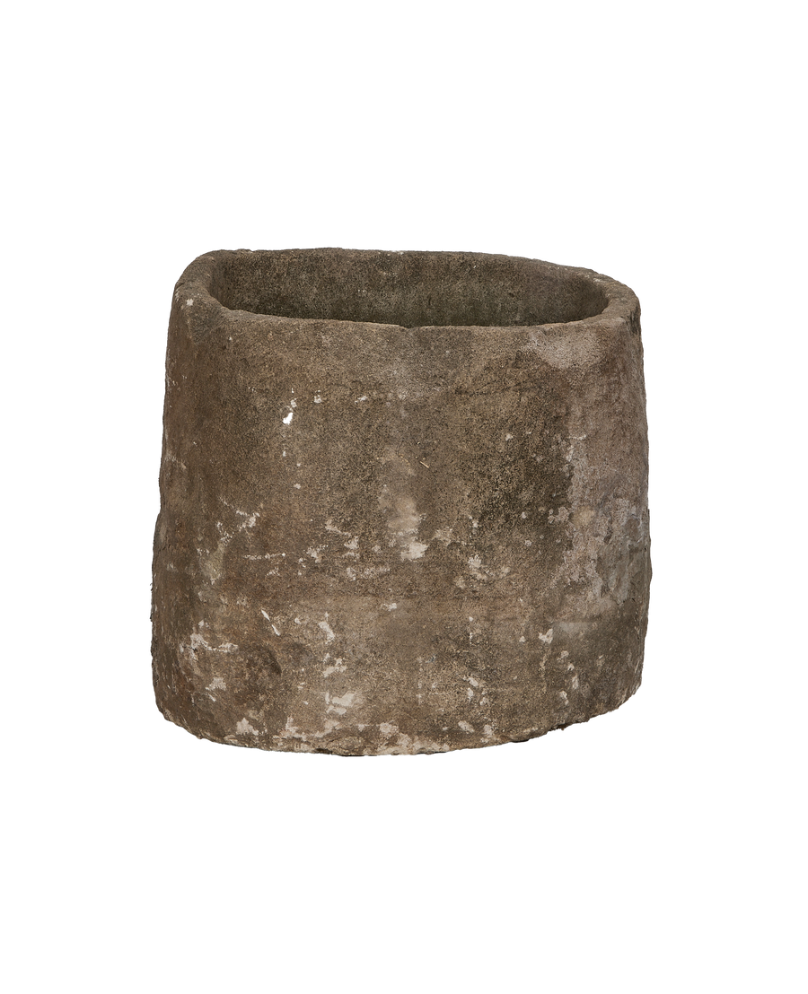 Vintage round limestone trough from Indonesia, showing rough texture and weathered finish.
