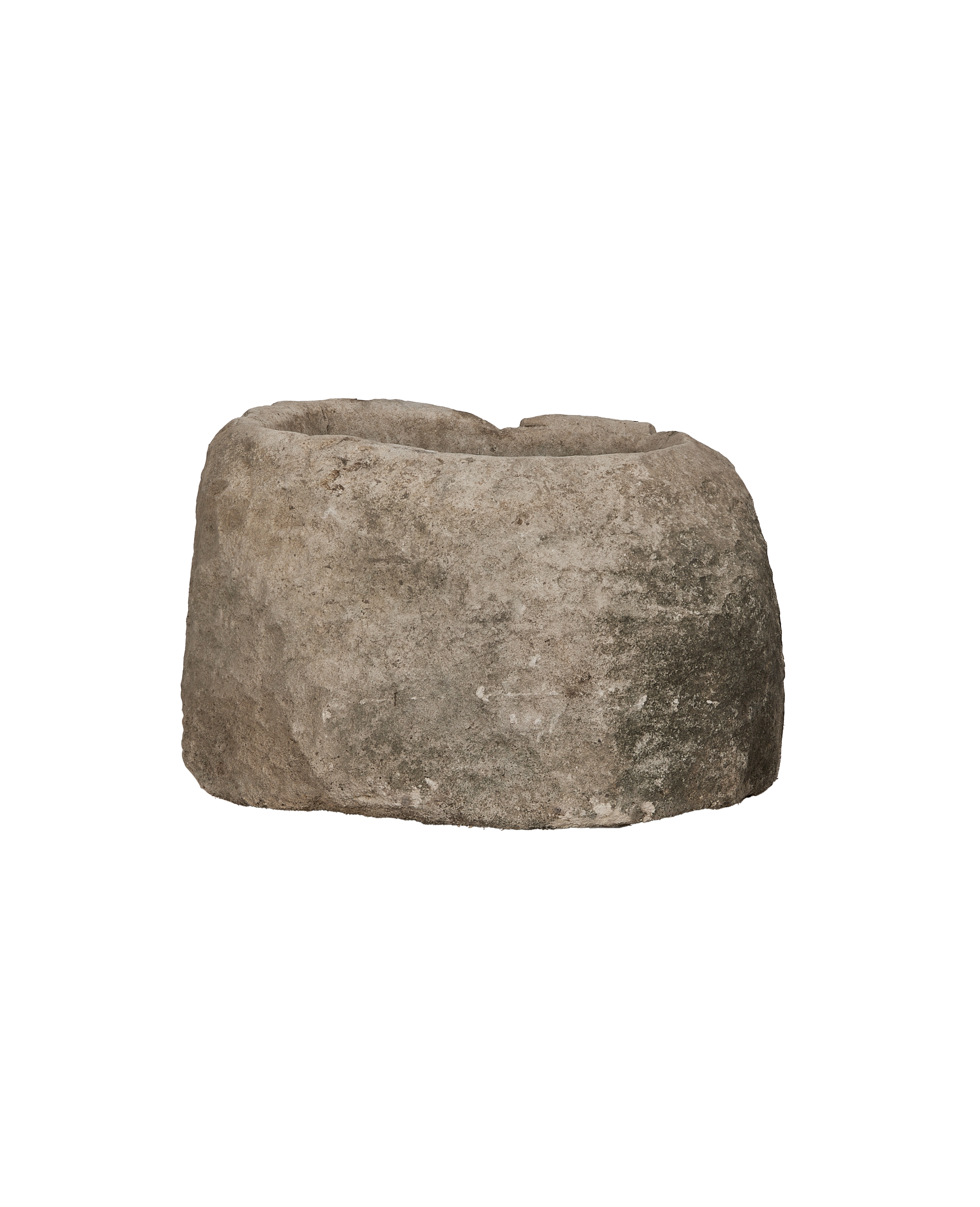Vintage oblong limestone trough from Indonesia, weathered surface, wide-angle view, black background.