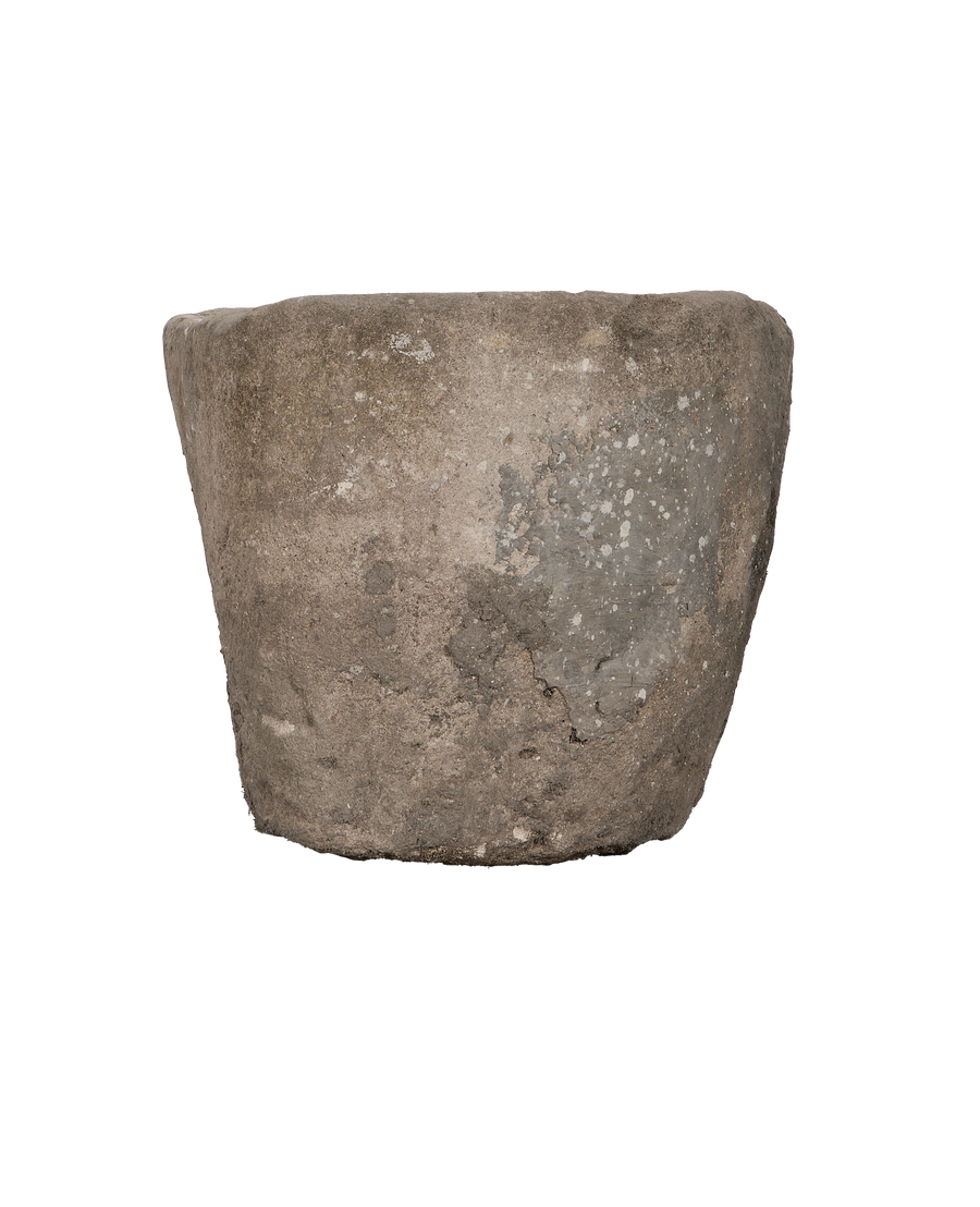 Vintage Indonesian limestone trough, close-up of textured exterior with visible weathering.