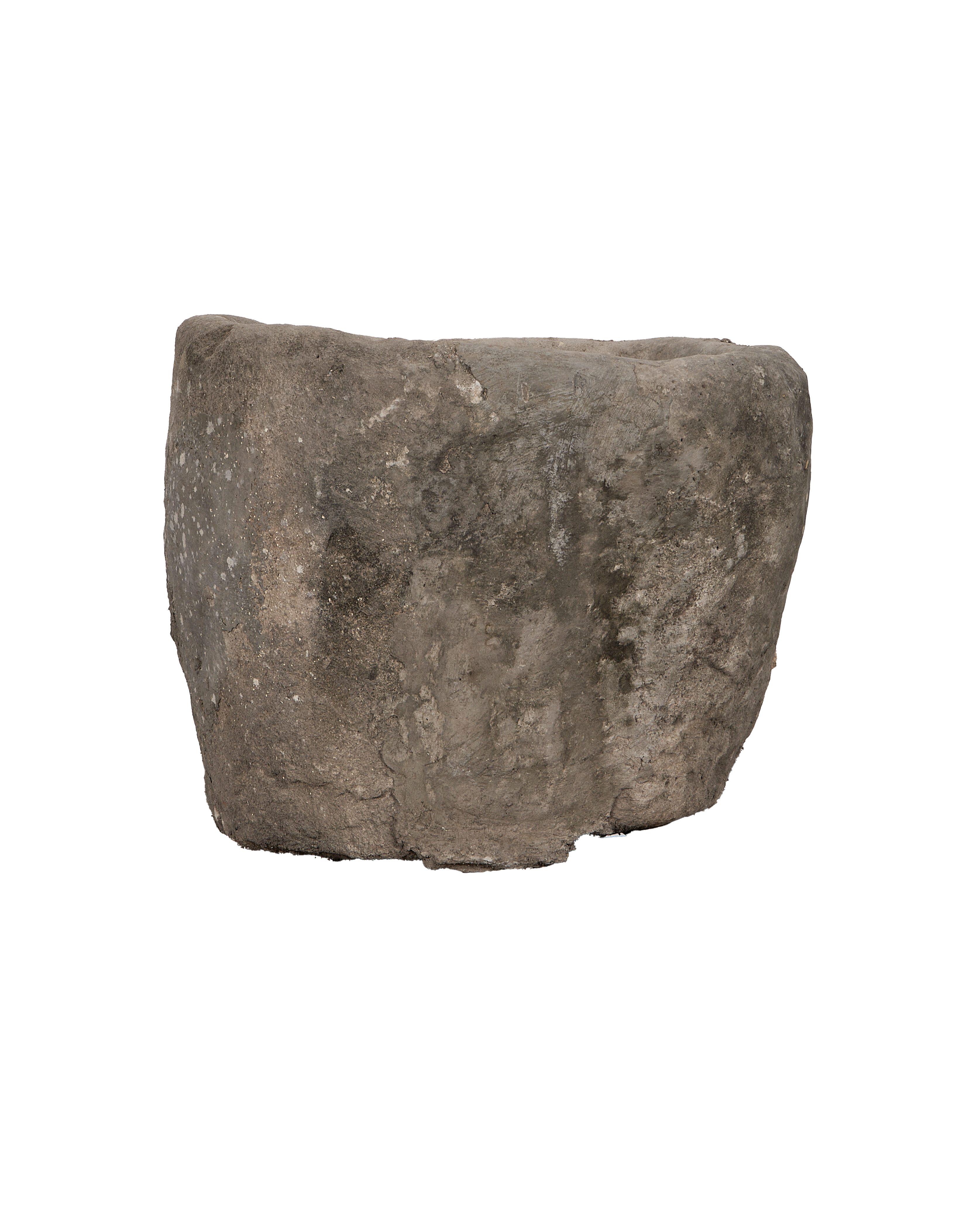 Vintage Indonesian limestone trough, thick oblong shape, side view showing weathered surface texture.