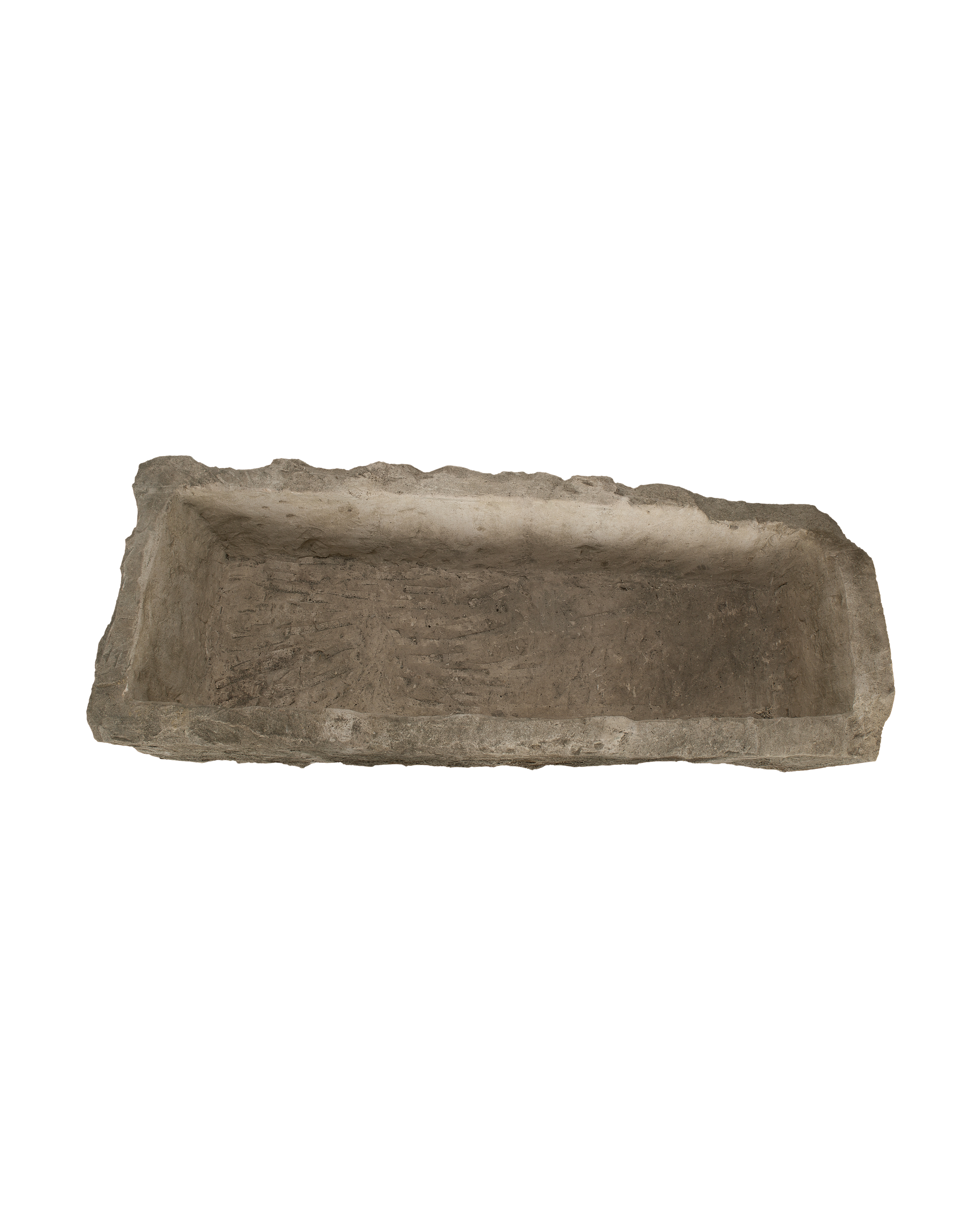 Vintage Indonesian limestone rectangular trough, top-down view showing interior texture and aged rough edges.