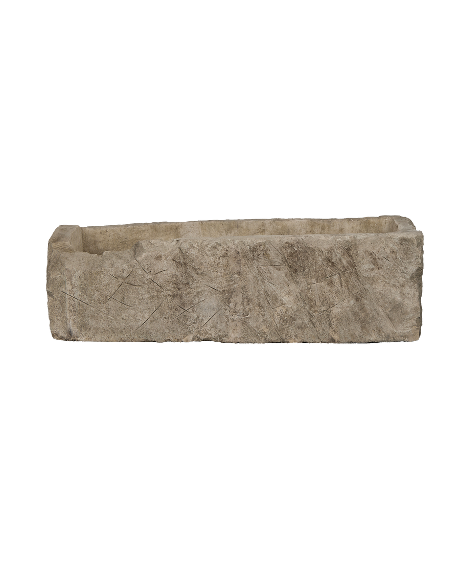 Vintage Indonesian rectangular limestone trough showing rough-hewn texture and chisel marks on its side.