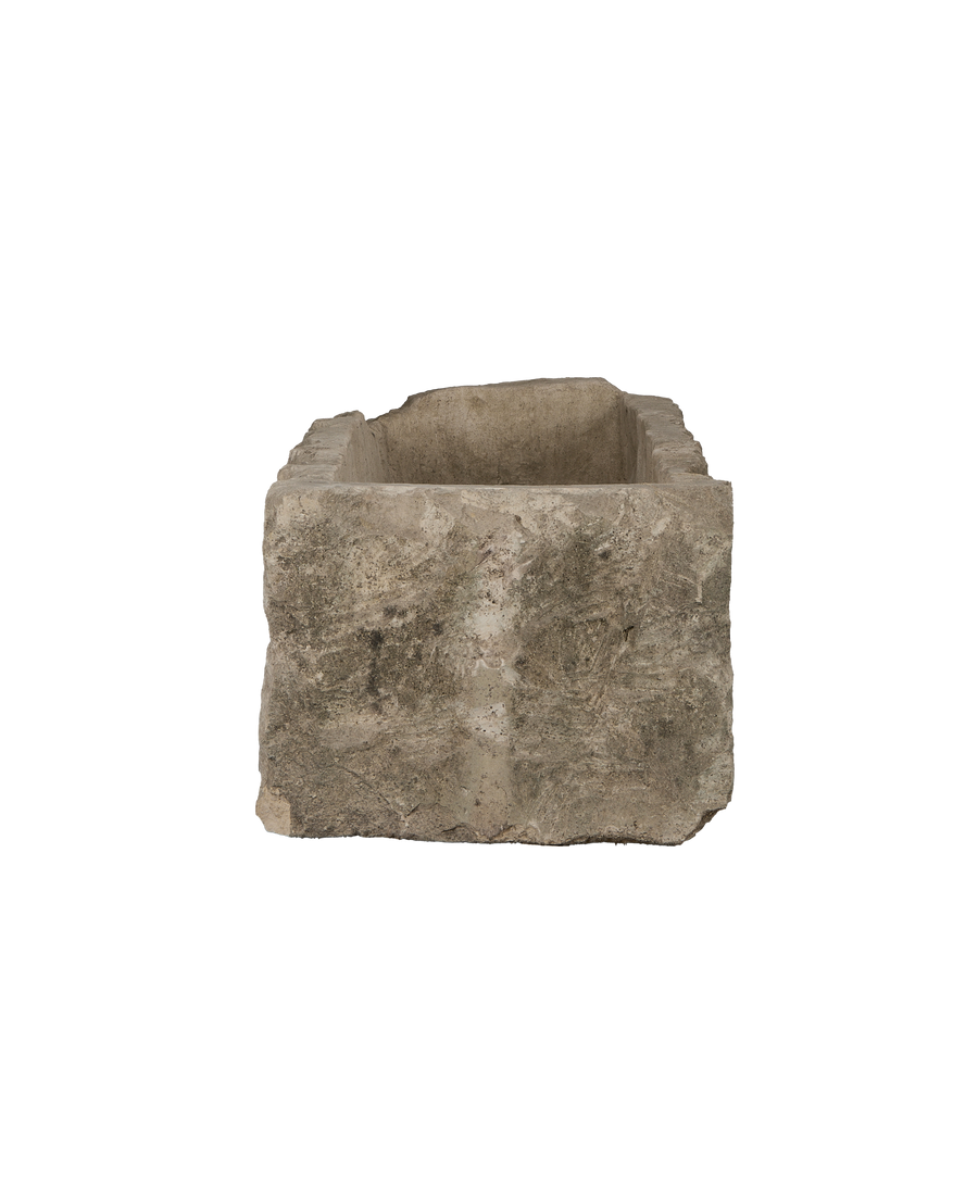 Vintage rectangular limestone trough, showing the rustic weathered texture and thick rim.