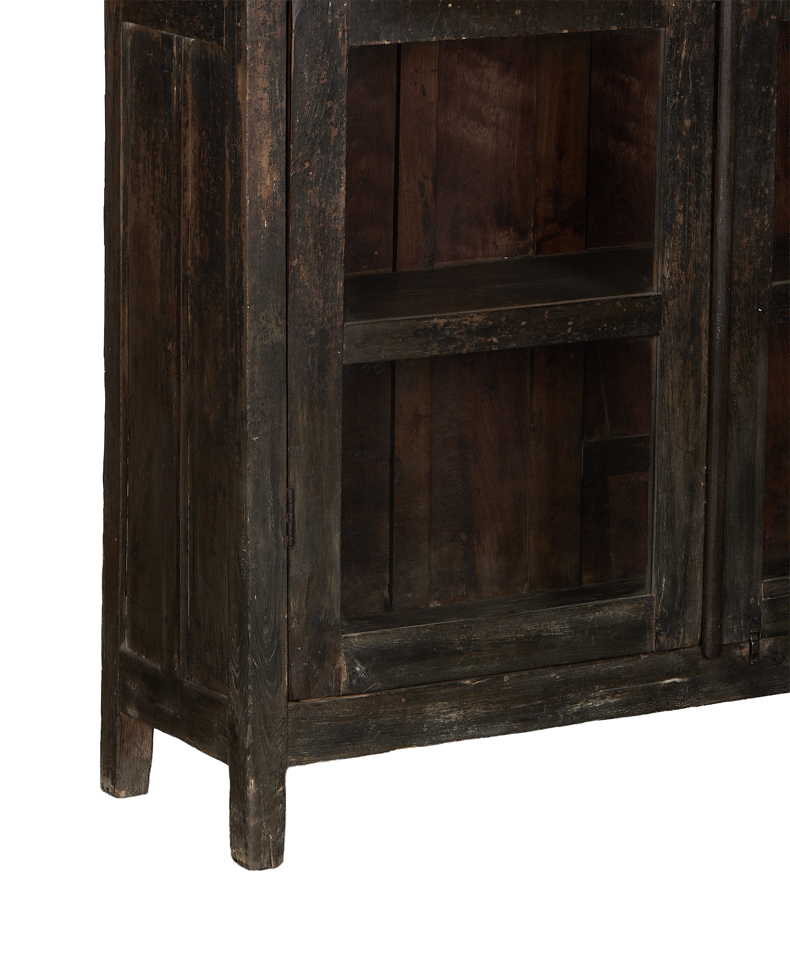 Vintage Indian oak cabinet bottom showing sturdy construction, distressed dark stain, and short legs.