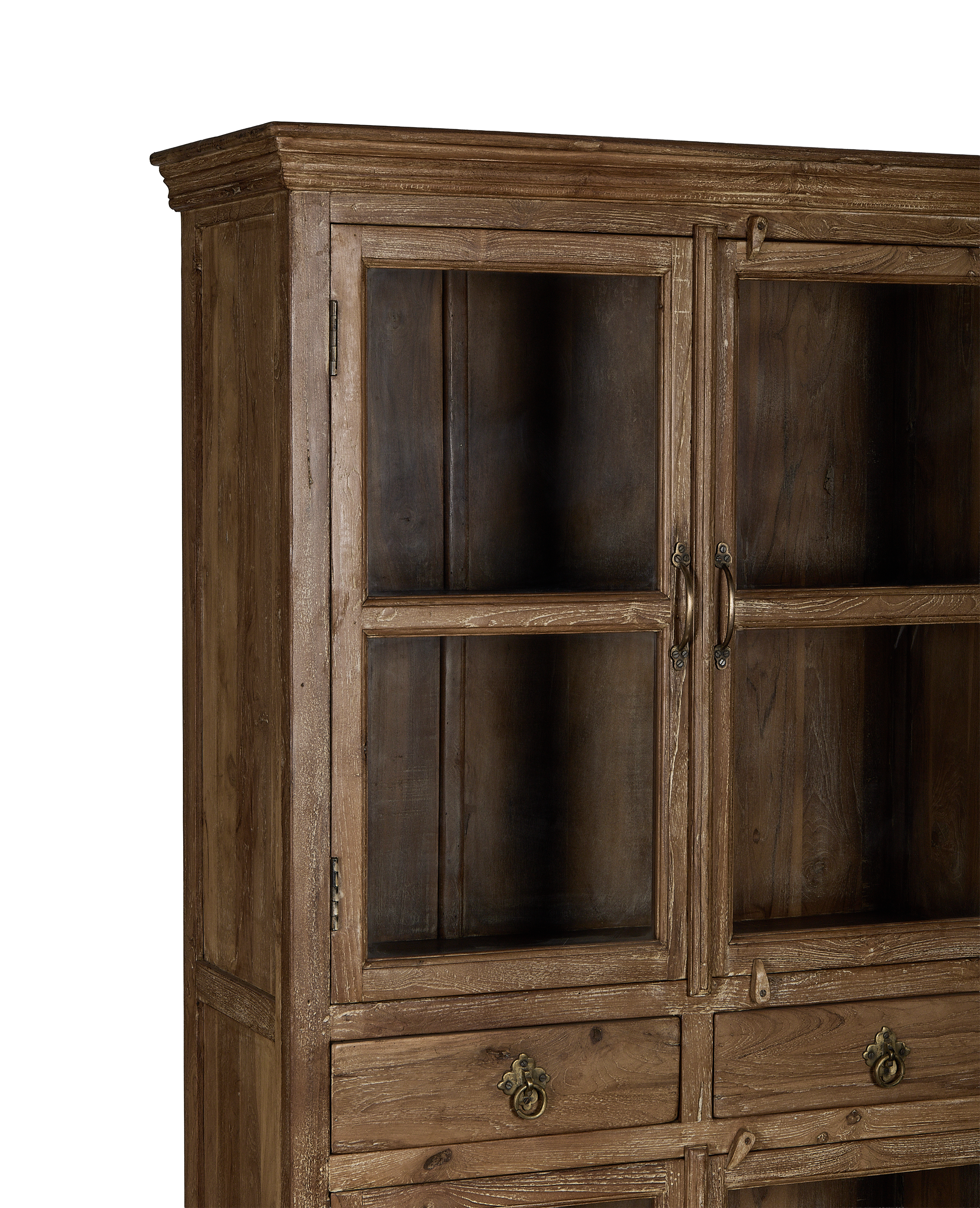Vintage Indian oak wood cabinet, close-up of glass doors, antique brass handles, worn finish.
