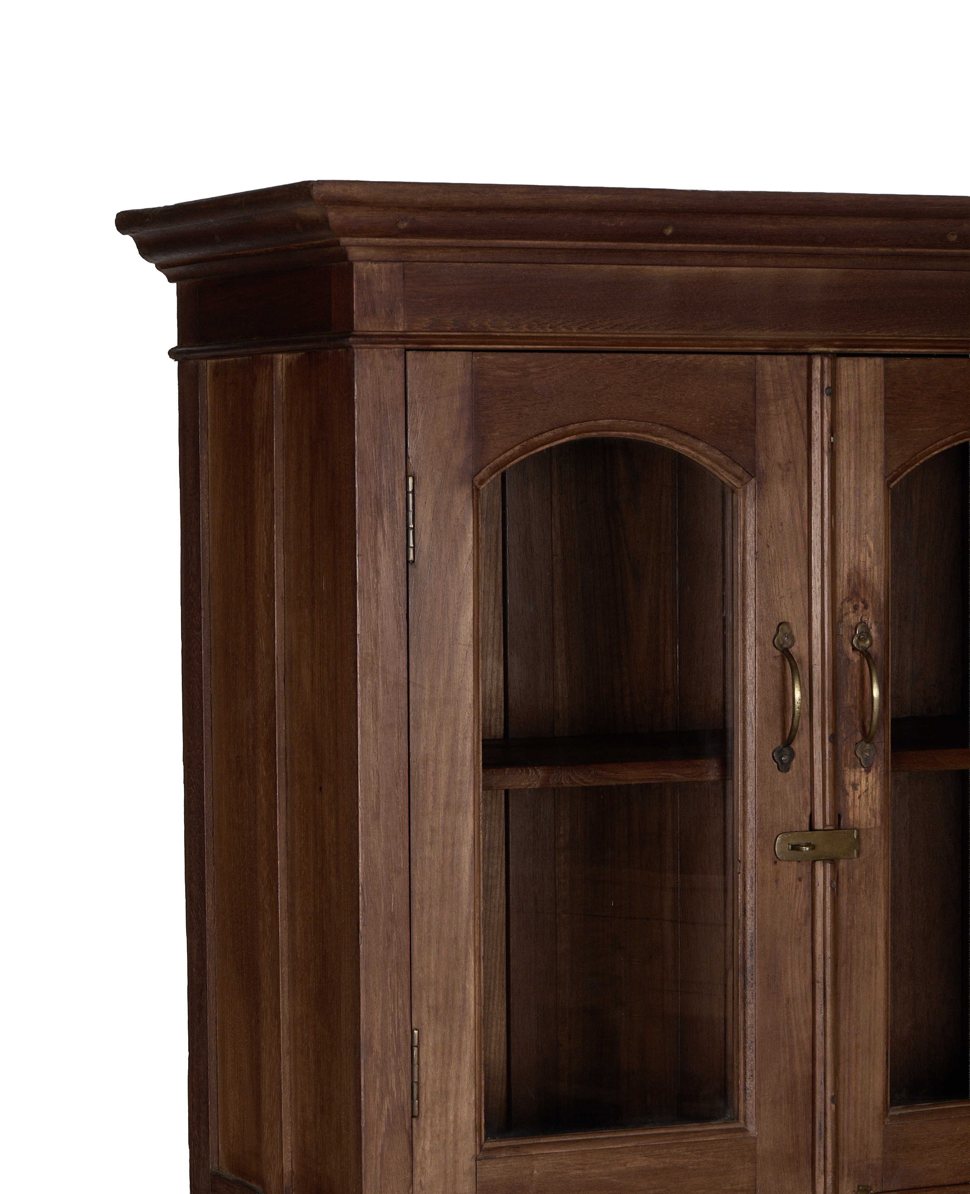 Natural oak vintage Indian cabinet, showing arch glass doors, brass hardware, and intricate molding details.