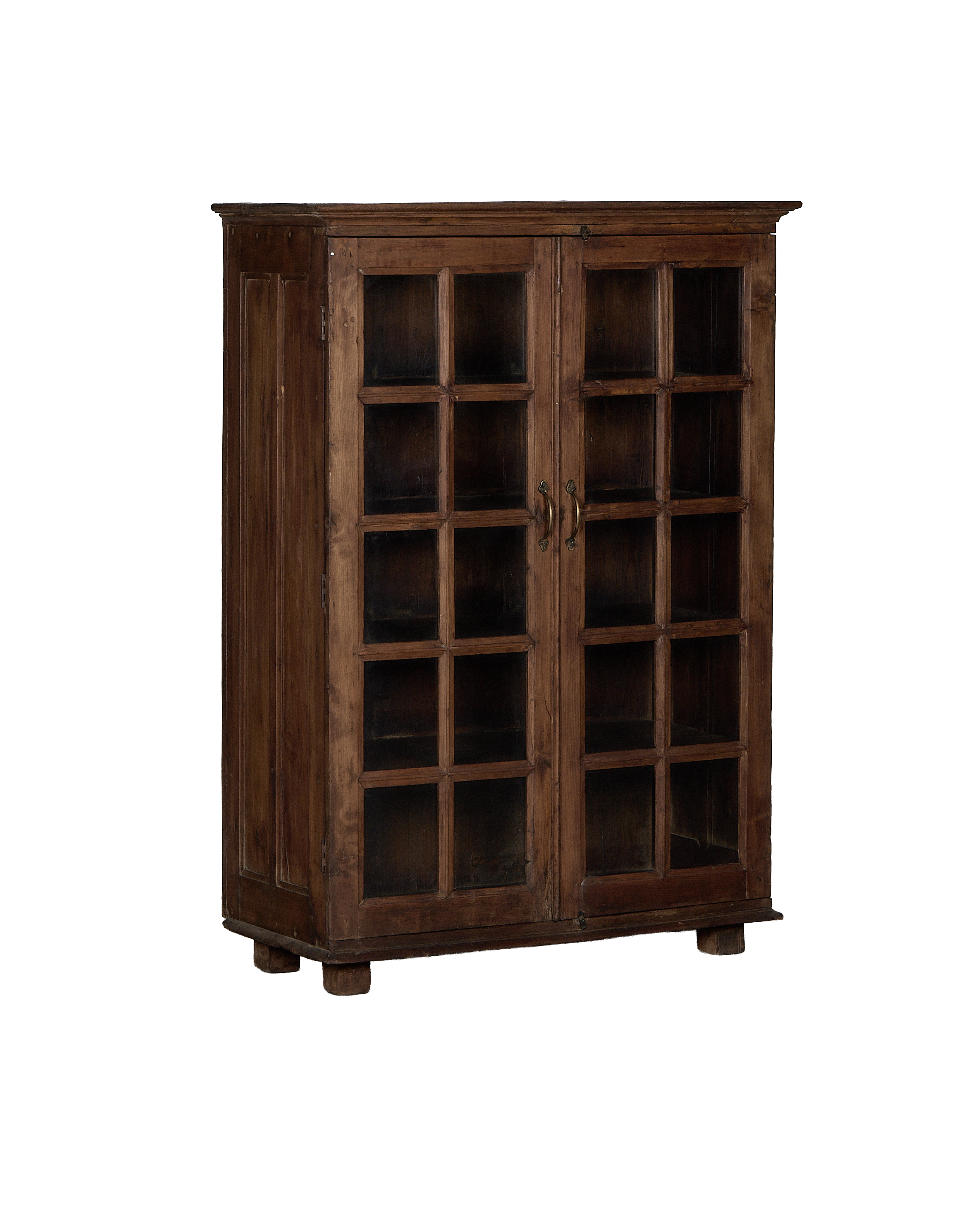 Vintage Indian oak cabinet, full frontal view, showing glass paneled doors and brass handles.