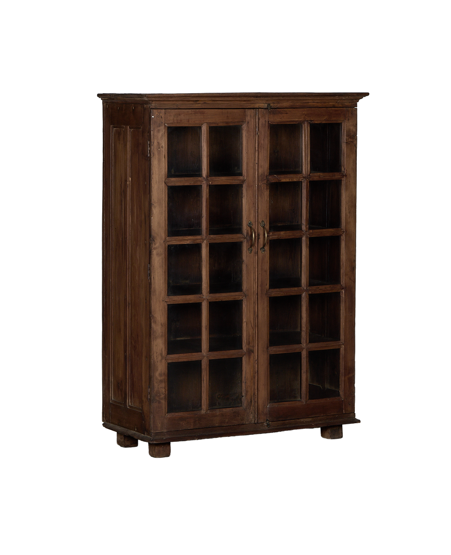 Vintage Indian oak cabinet, full frontal view, showing glass paneled doors and brass handles.