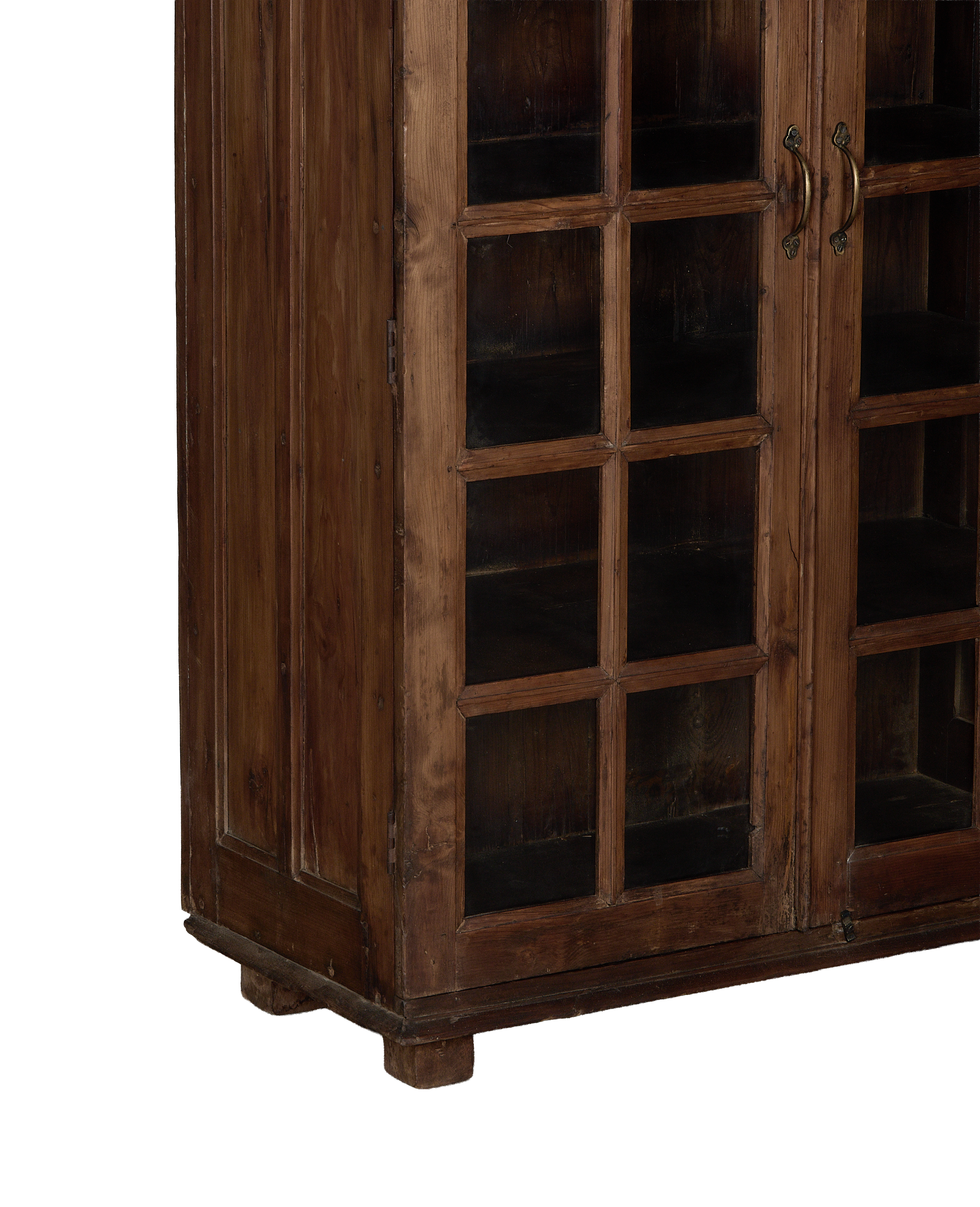 Vintage natural oak wood cabinet from India, showing intricate glass paneled doors and brass handles.