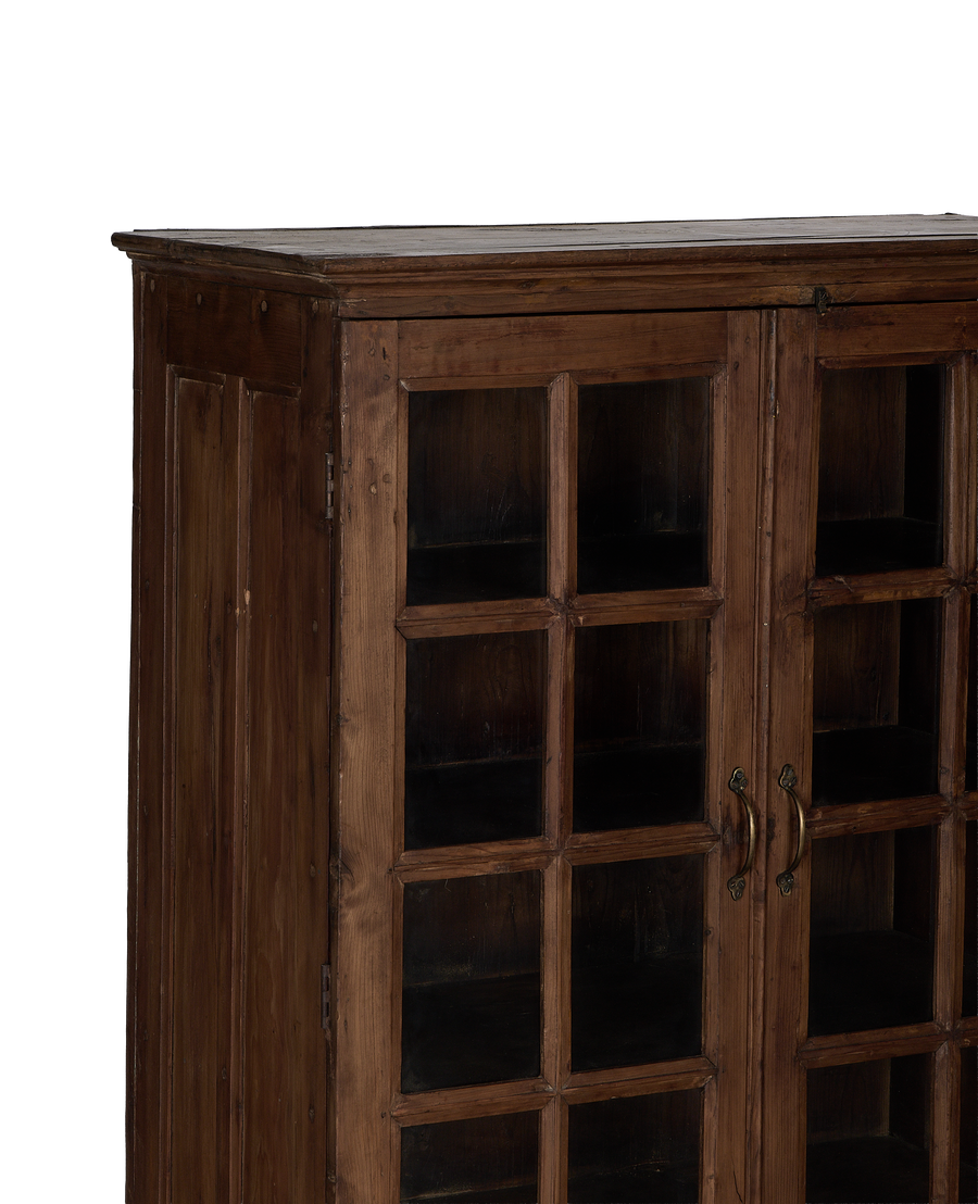 Vintage natural oak cabinet from India, showcasing detailed glass doors and aged top.