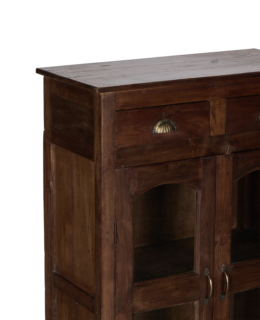 Vintage Indian oak cabinet featuring two drawers with brass pulls, visible top grain.