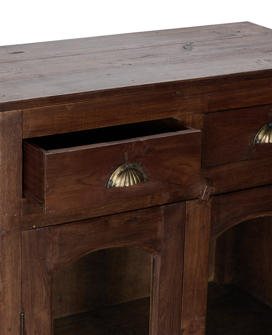Vintage Indian oak wood cabinet, open drawer with brass handle, aged natural finish.
