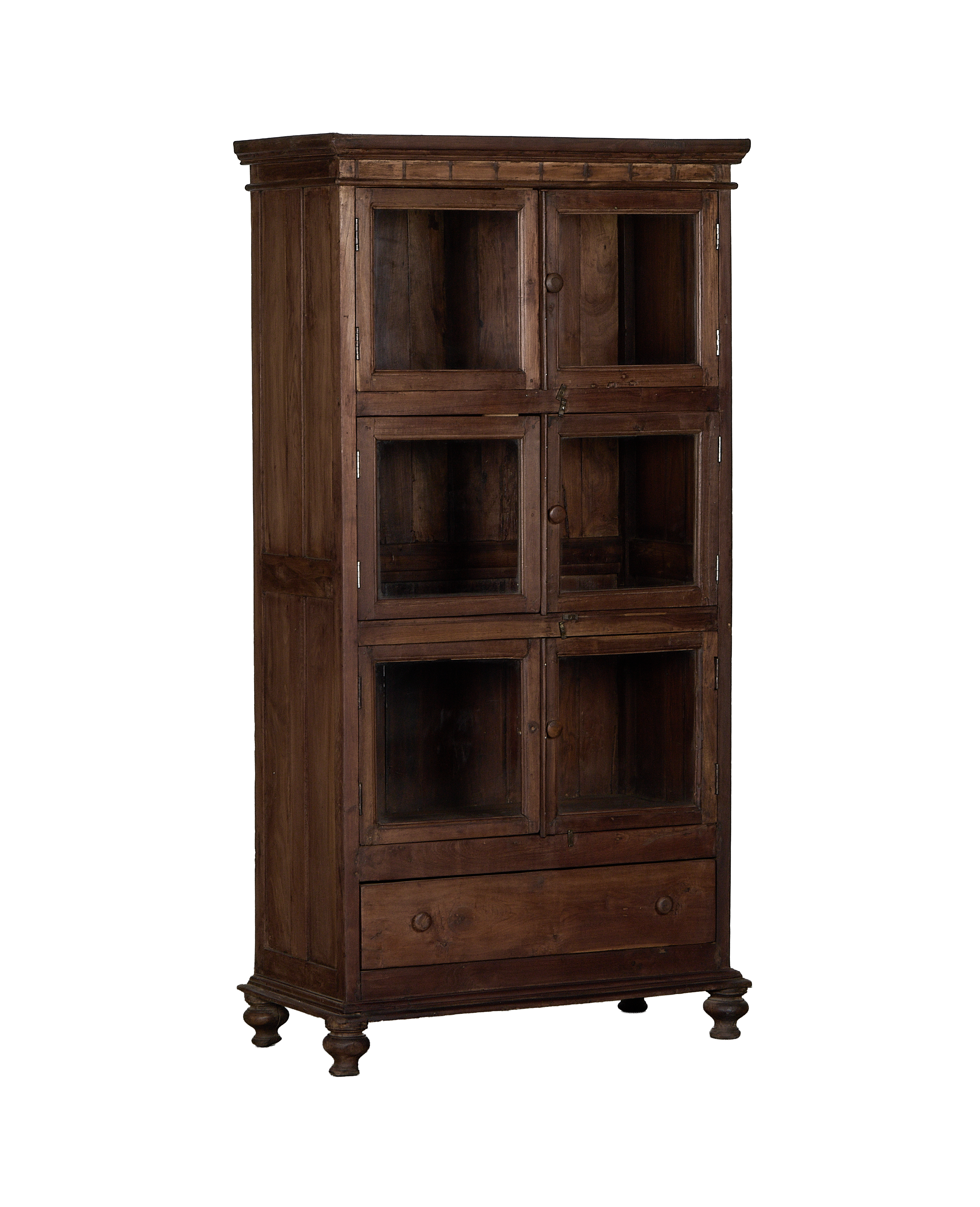 Vintage Indian oak cabinet, full frontal view, showing eight glass-fronted compartments and a single drawer.