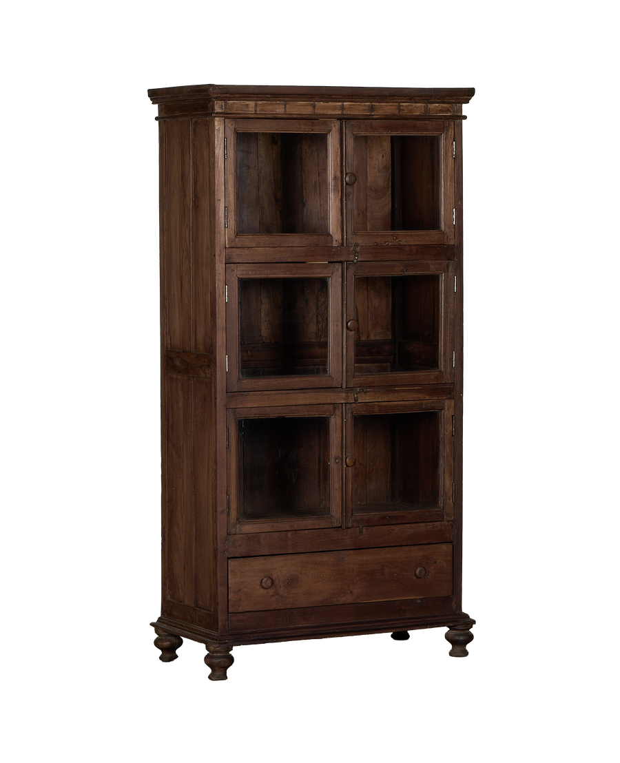 Vintage Indian oak cabinet, full frontal view, showing eight glass-fronted compartments and a single drawer.