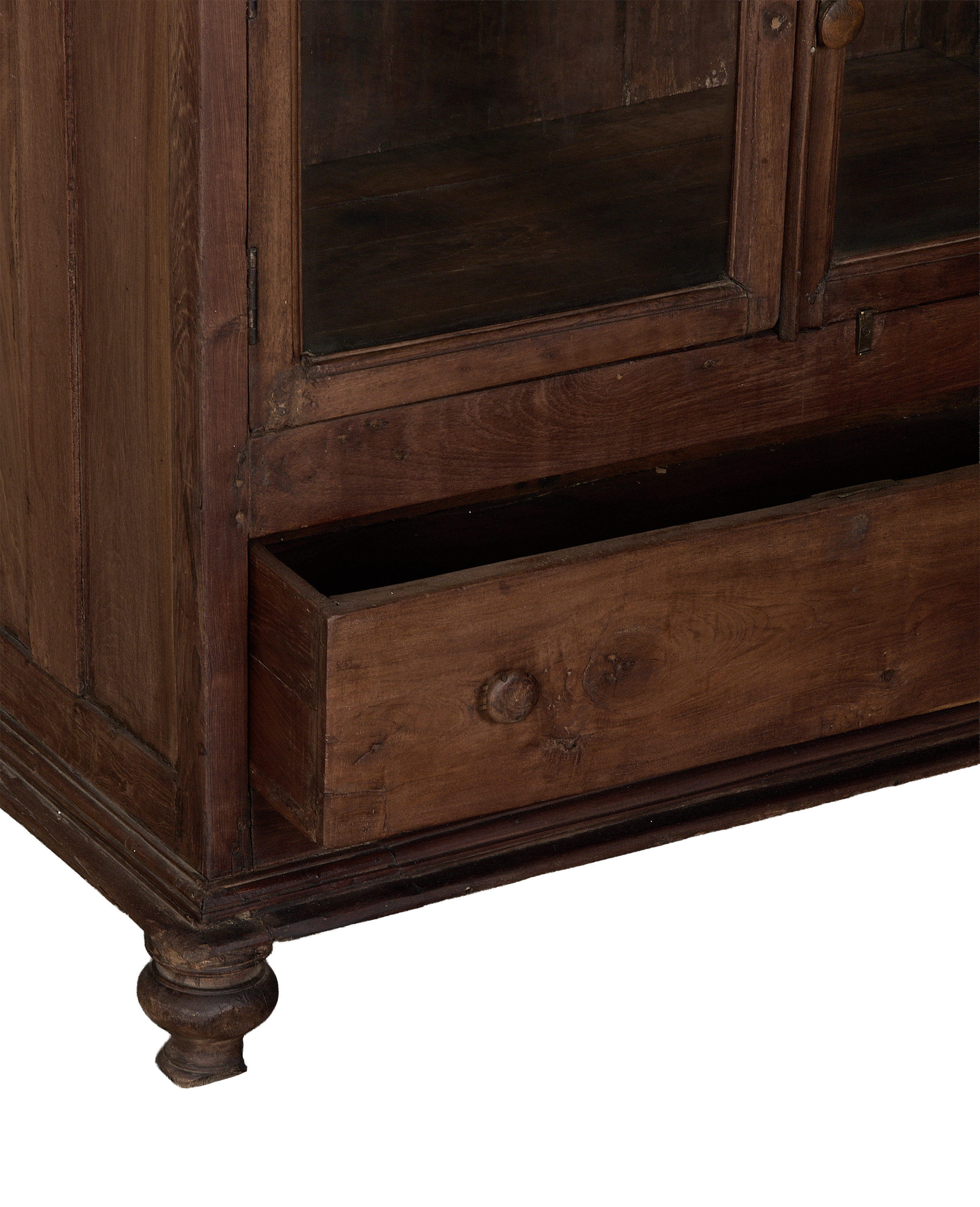 Vintage Indian oak wood cabinet, open drawer revealing interior and turned feet.