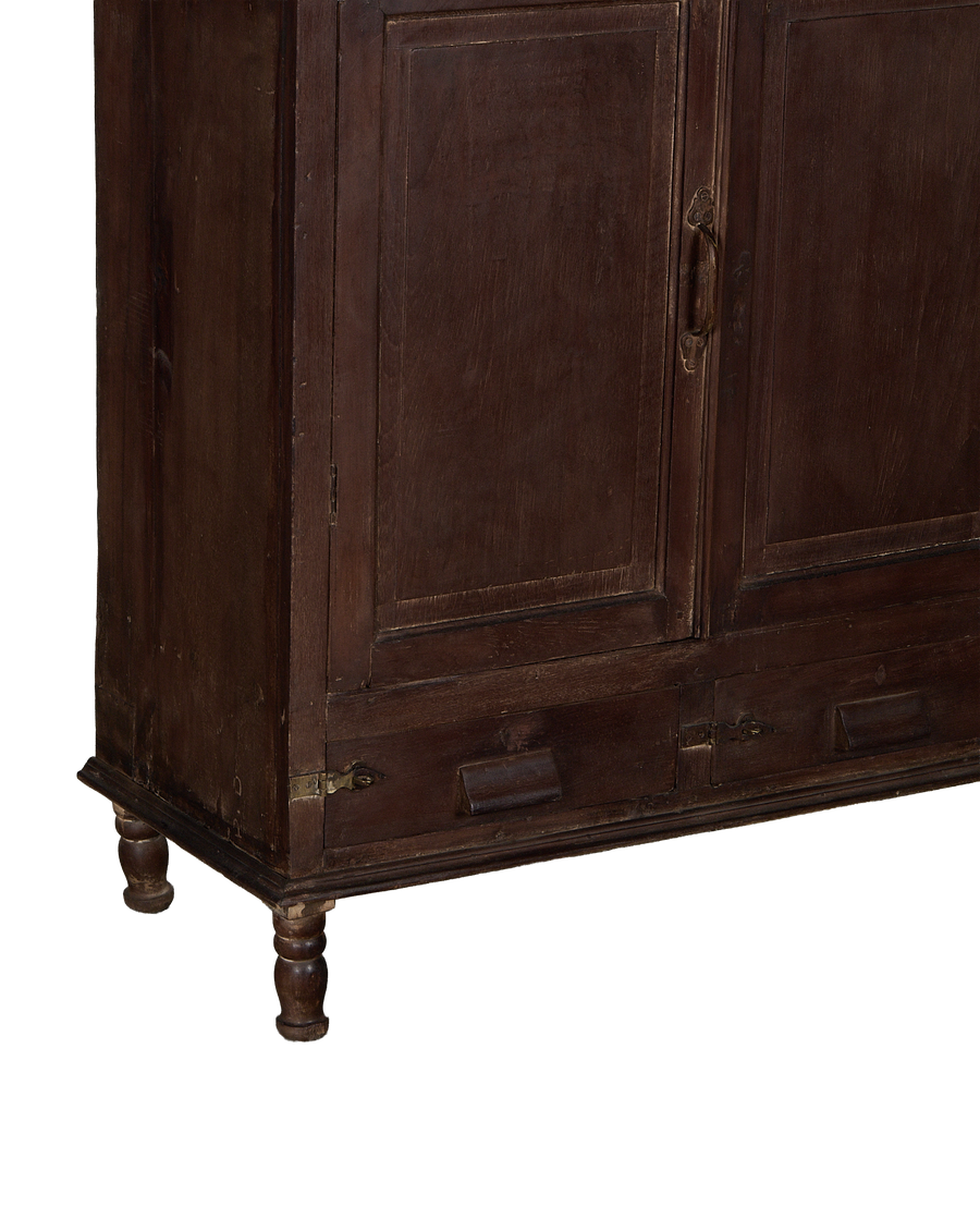 Vintage Indian stained oak cabinet with doors, brass latch, single pull-out drawer, and turned legs.