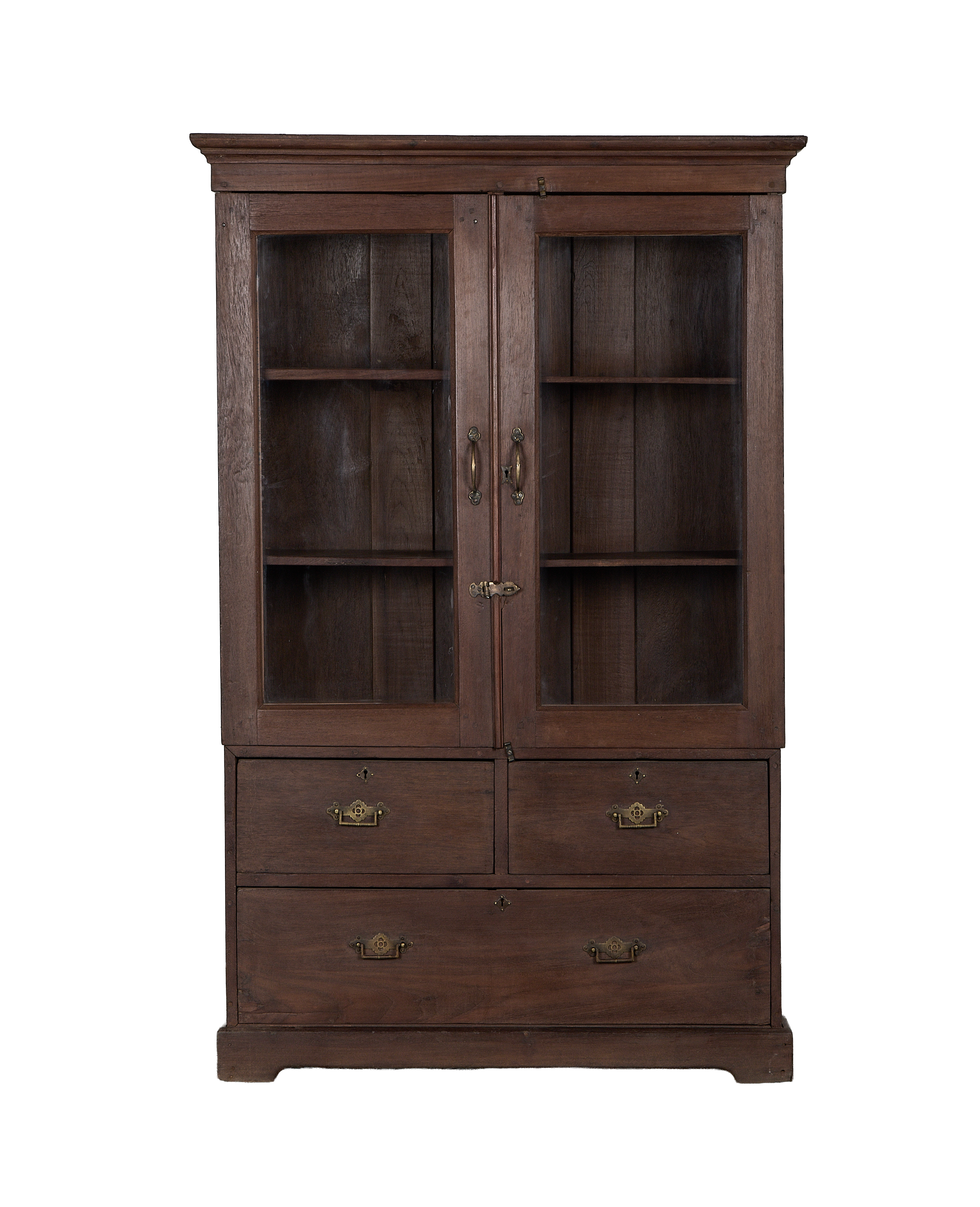 Vintage Indian oak cabinet, full shot, with glass doors, shelves, and brass-fitted drawers.