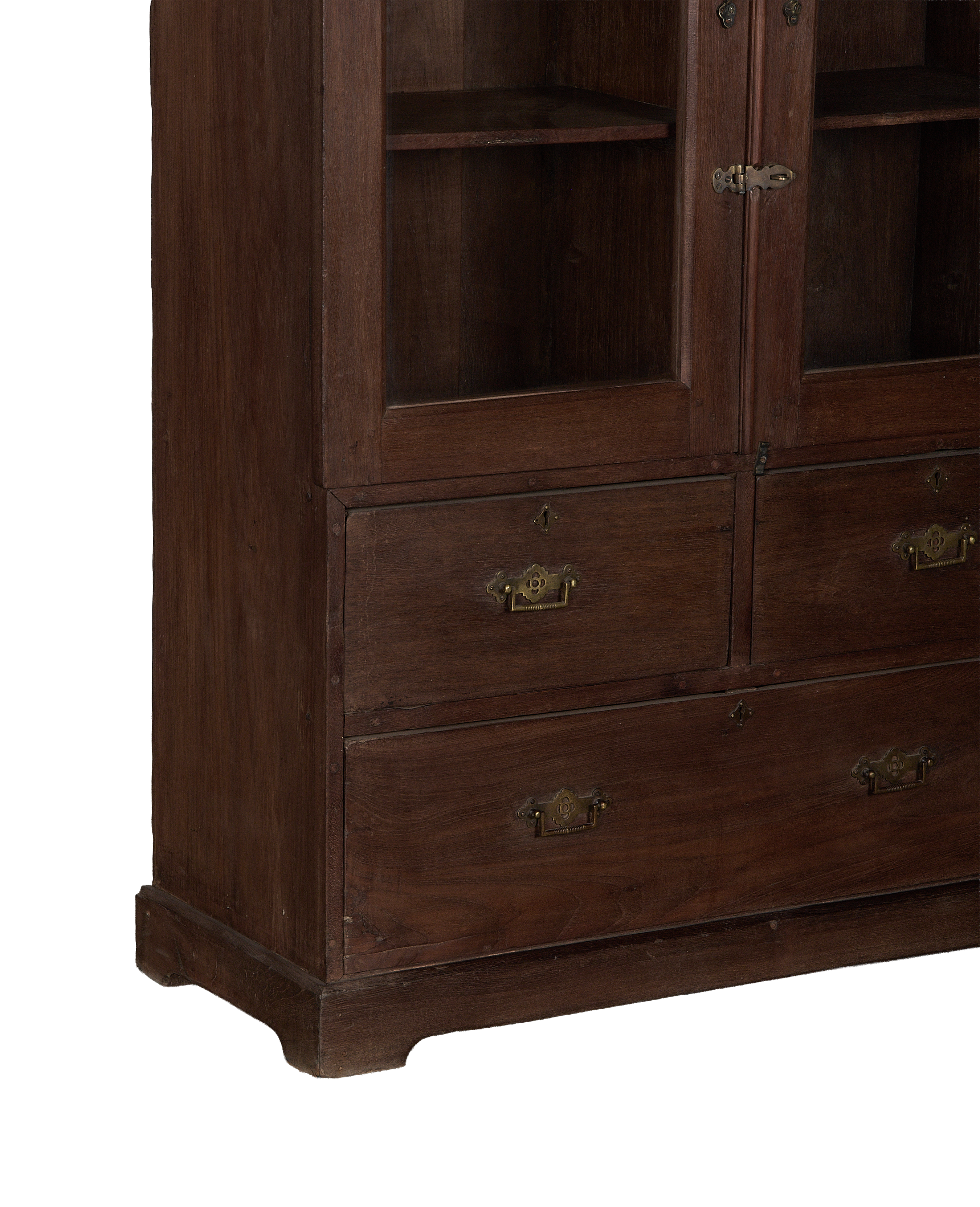 Vintage Indian oak cabinet details: glass doors, drawers with brass handles, carved base.