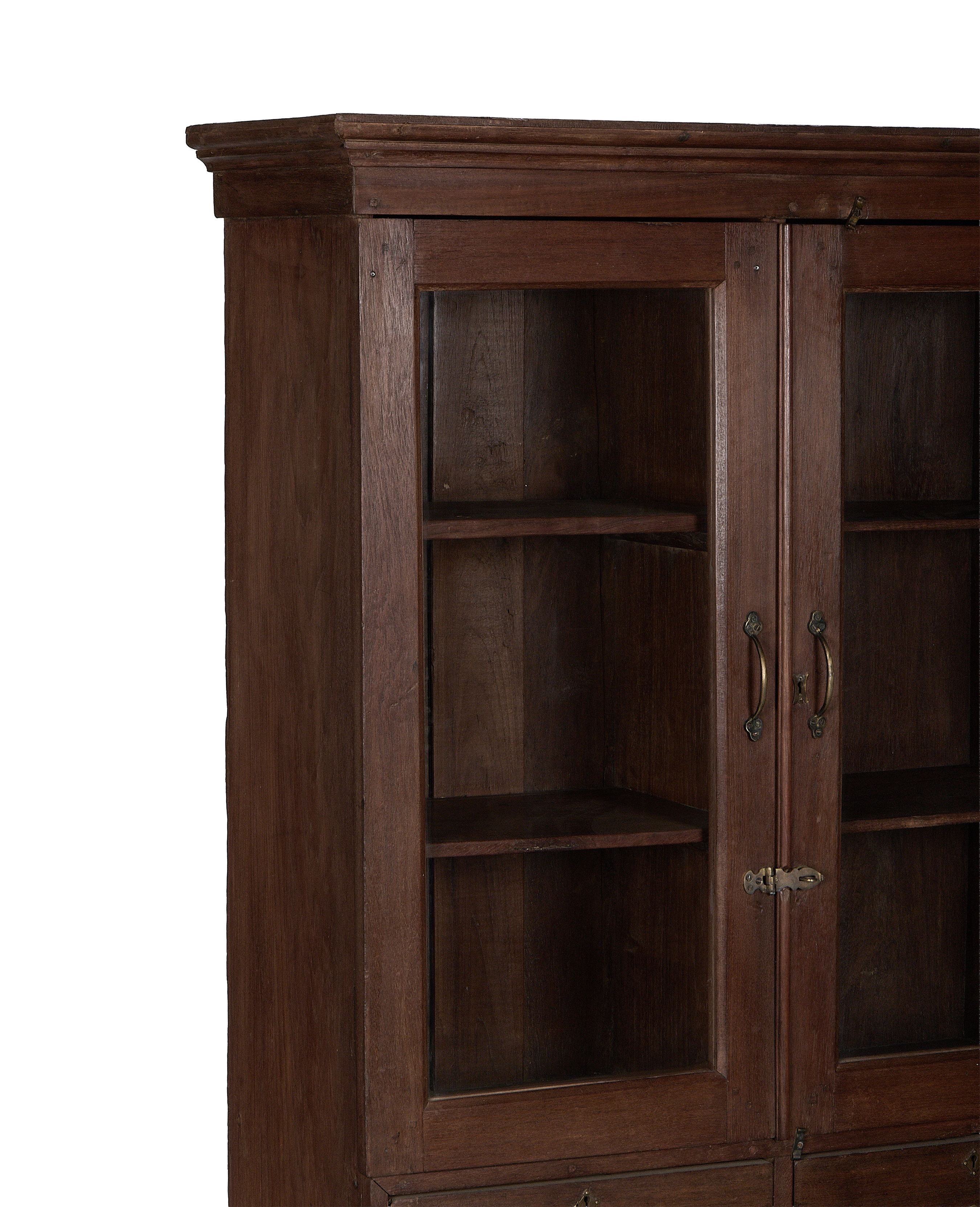 Vintage Indian oak cabinet: detailed view of glass doors, shelves, and brass hardware.