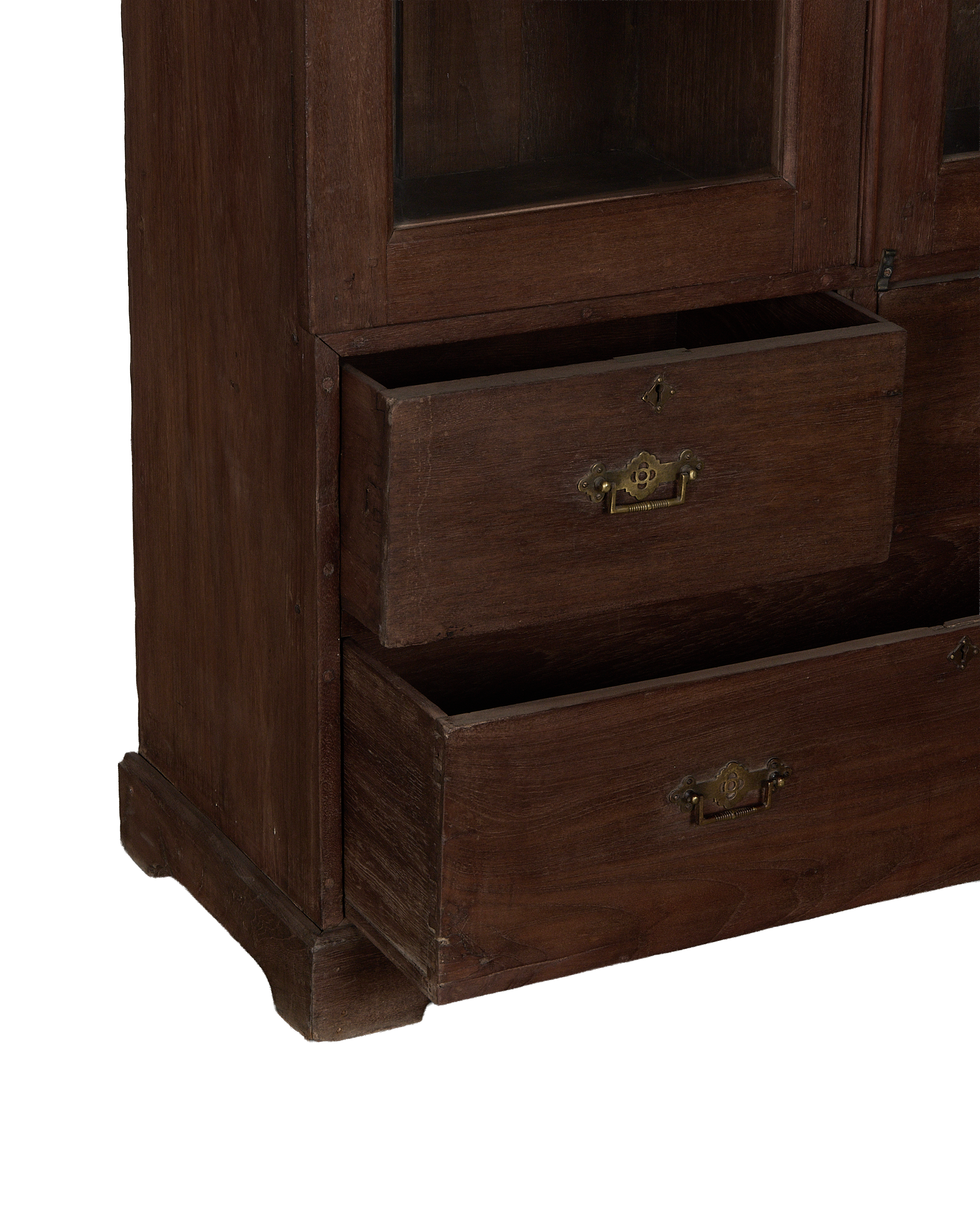 Vintage Indian oak cabinet detail, showing open drawers with antique brass hardware and lockplates.