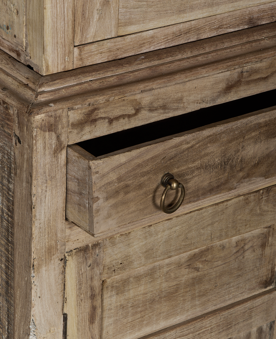 Vintage bleached oak cabinet with open drawer, detailed close-up of aged wood grain.