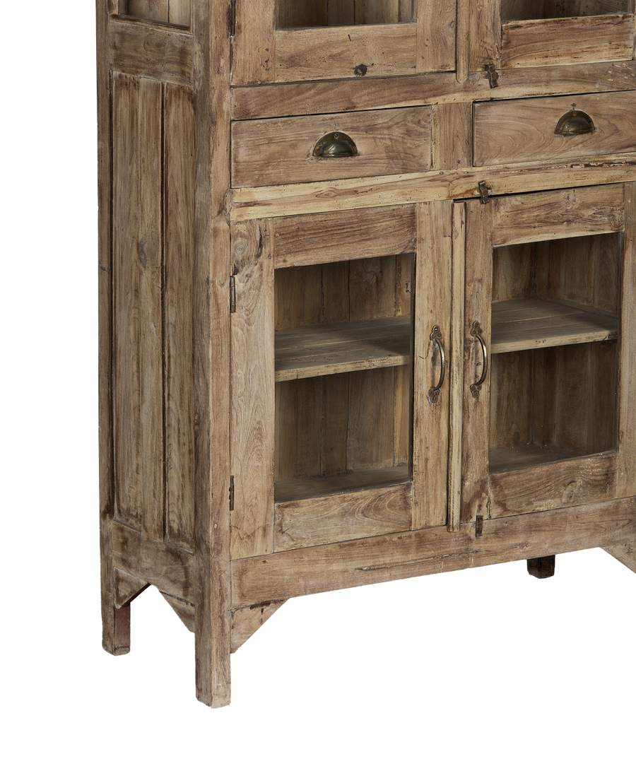 Detailed view of vintage Indian oak wood cabinet's lower half, showing doors, drawers, and aged patina.
