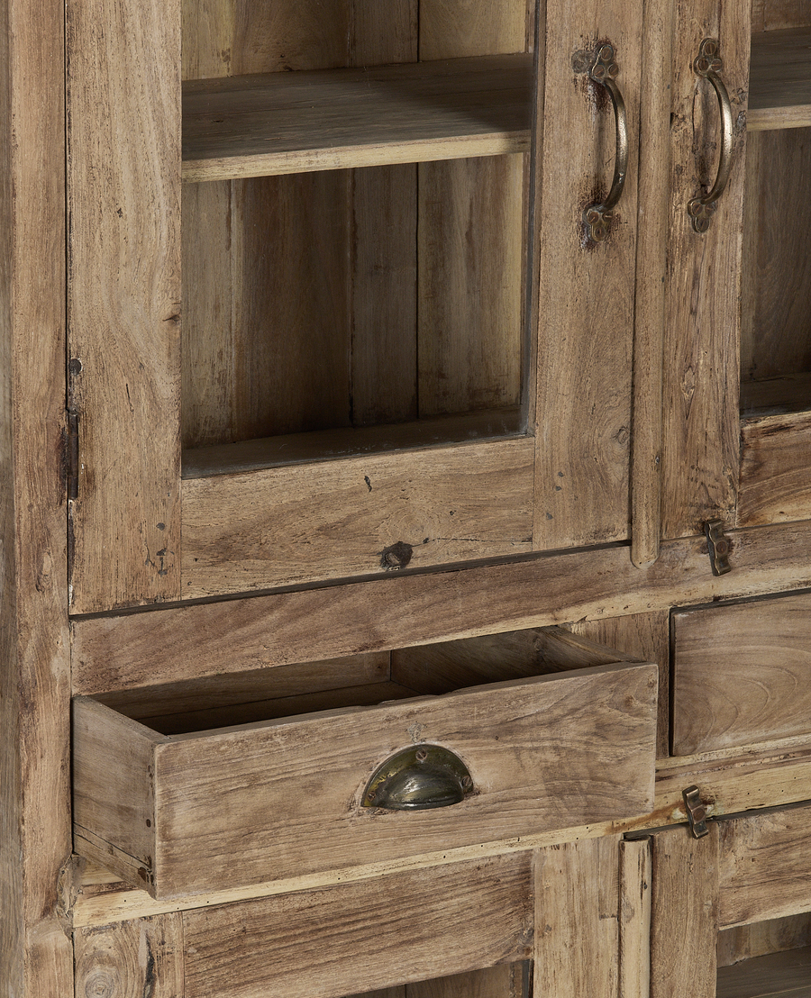 Vintage Indian oak cabinet detail, open drawer showing aged wood, patinated brass pull handle.