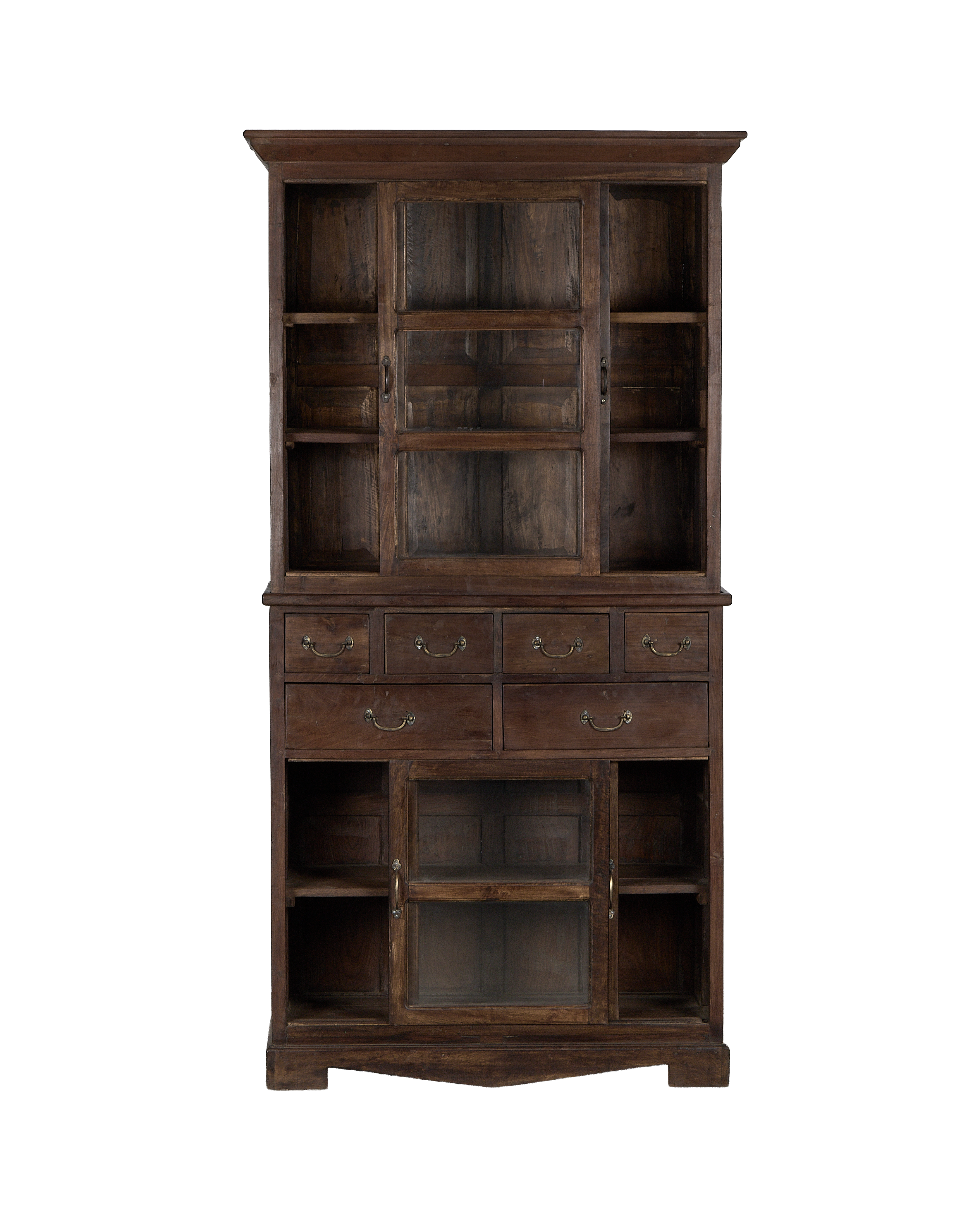 Vintage Indian oak cabinet, full frontal view, showing glass doors, brass pulls, and open shelving.