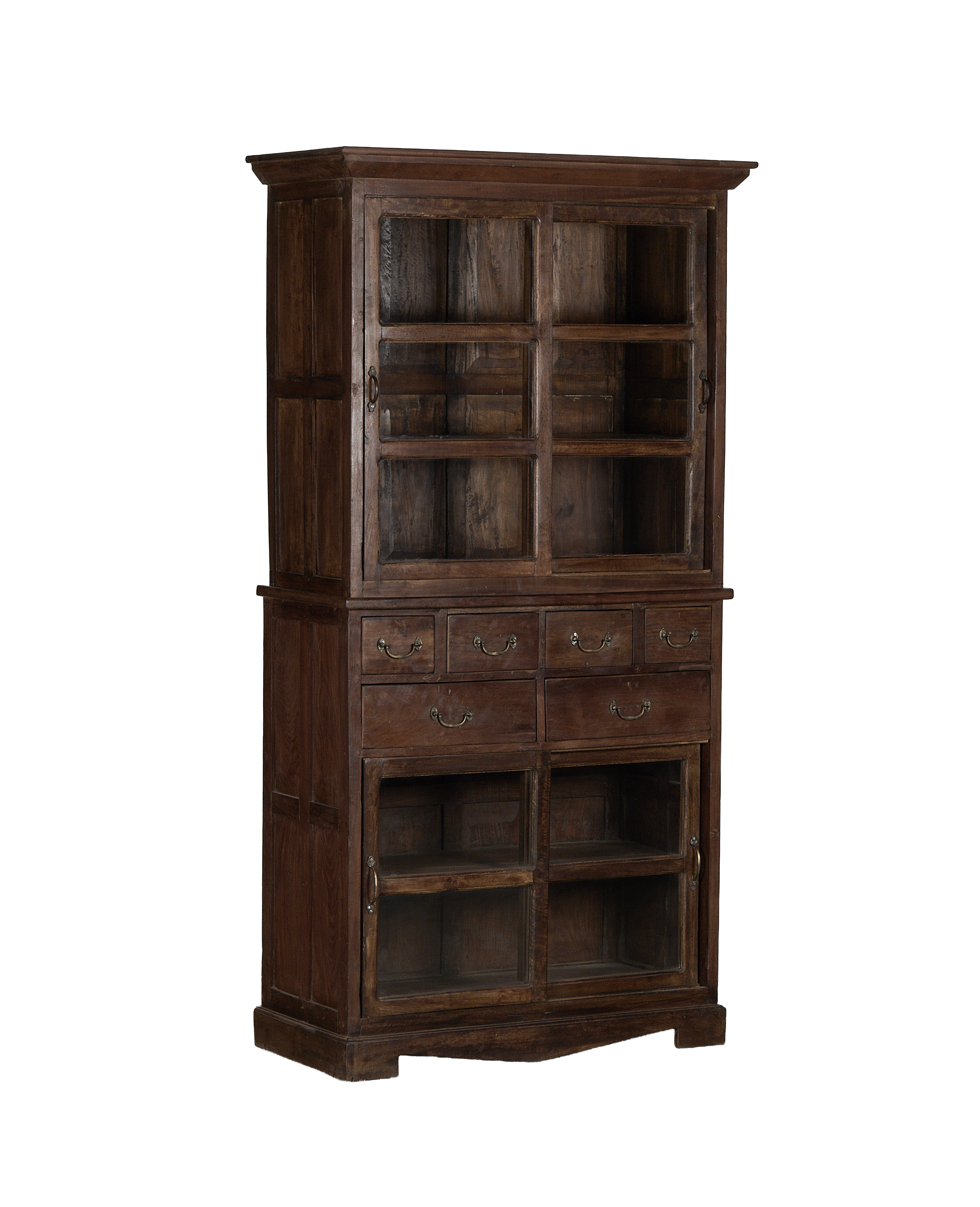 Vintage Indian oak cabinet, full frontal view, showing glass doors, brass hardware, and eight drawers.