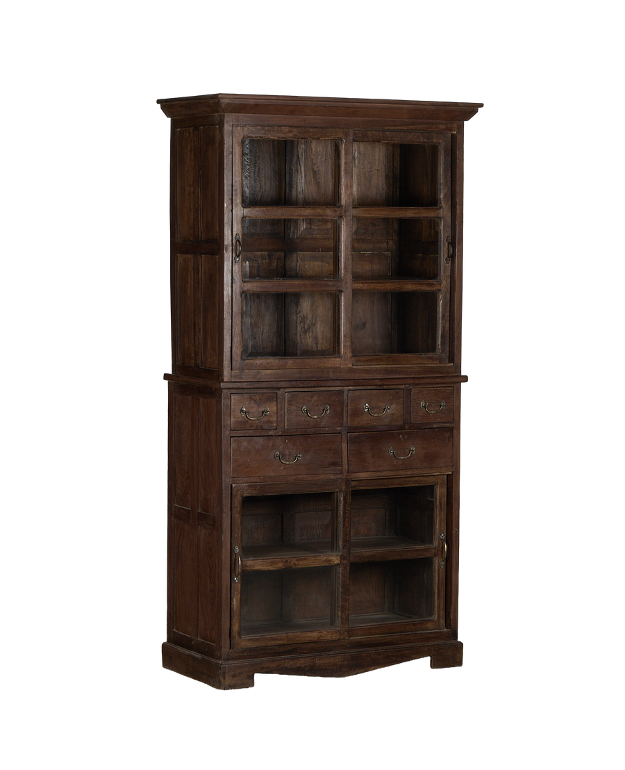 Vintage Indian oak cabinet, full frontal view, showing glass doors, brass hardware, and eight drawers.