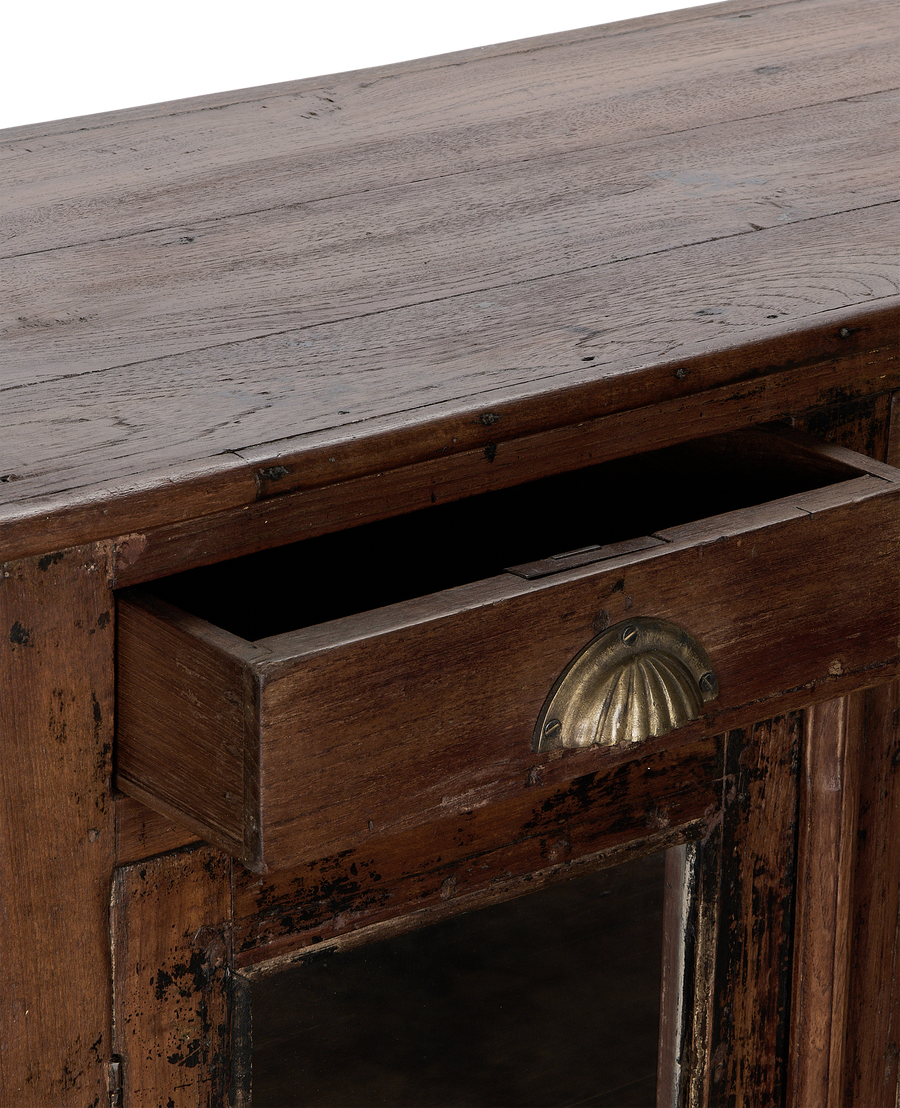 Vintage Indian oak cabinet, drawer open, showing aged brass scallop pull and dark distressed wood.
