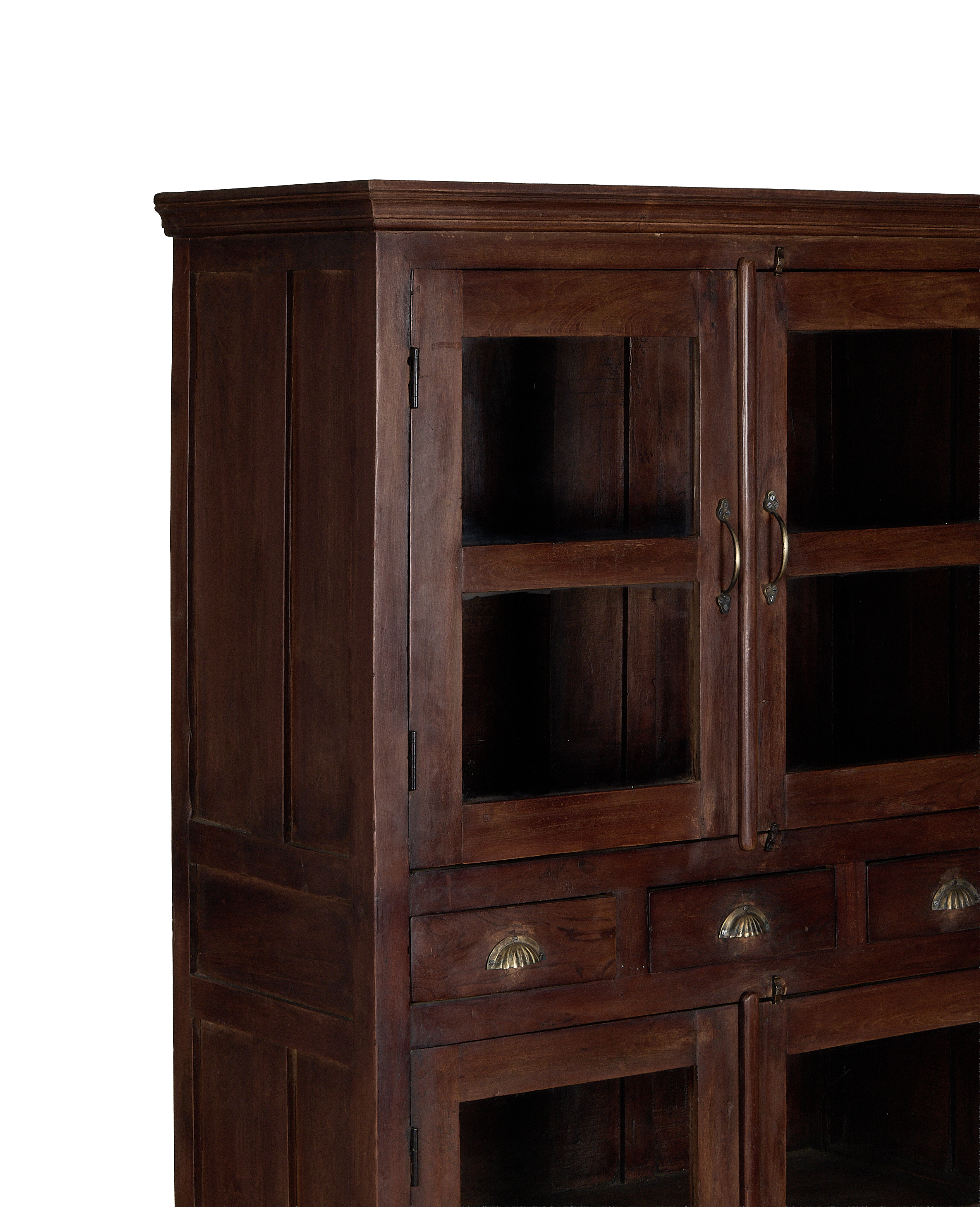 Vintage Indian oak cabinet featuring glass doors, brass hardware, and intricate molding detail.