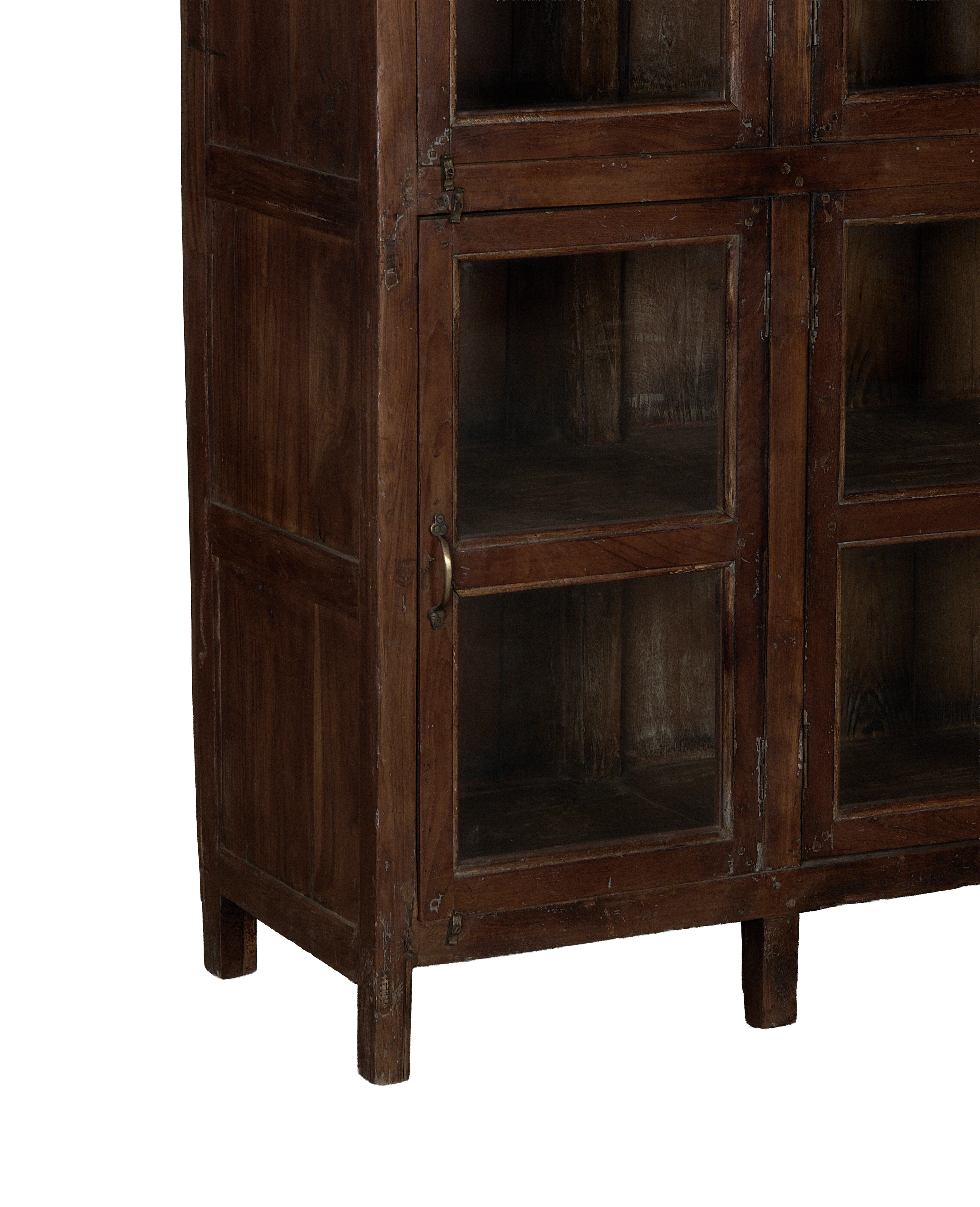 Vintage Indian oak wood cabinet, close-up of glass doors with aged brass pull.