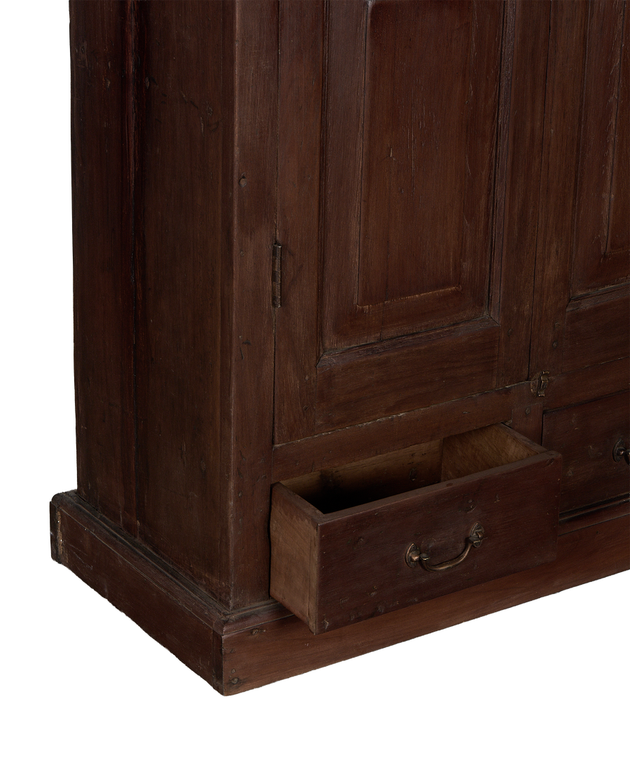 Vintage Indian oak cabinet featuring an open drawer with brass pull, showcasing natural wood grain.