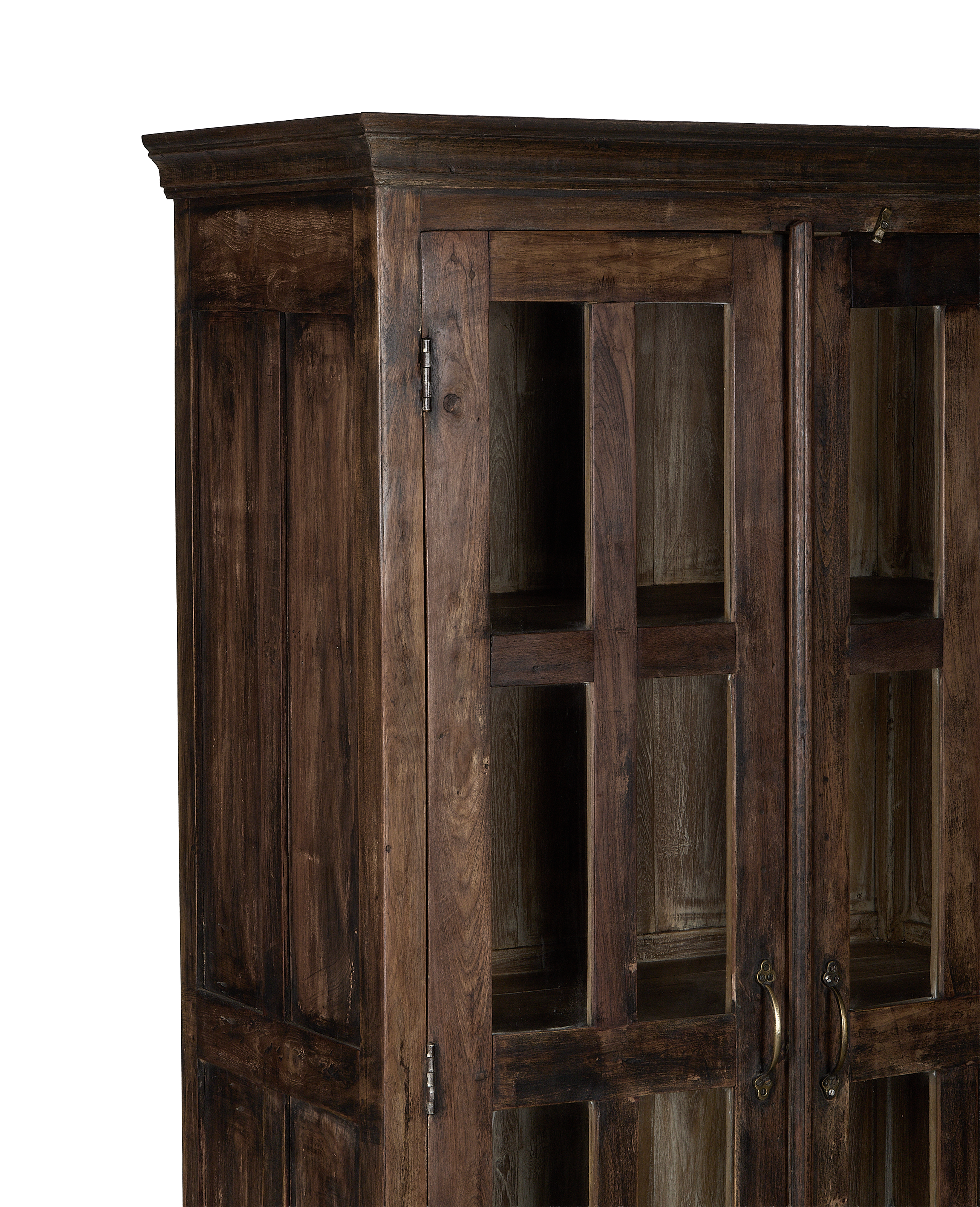 Close-up of vintage Indian oak wood cabinet's natural grain and glass doors.