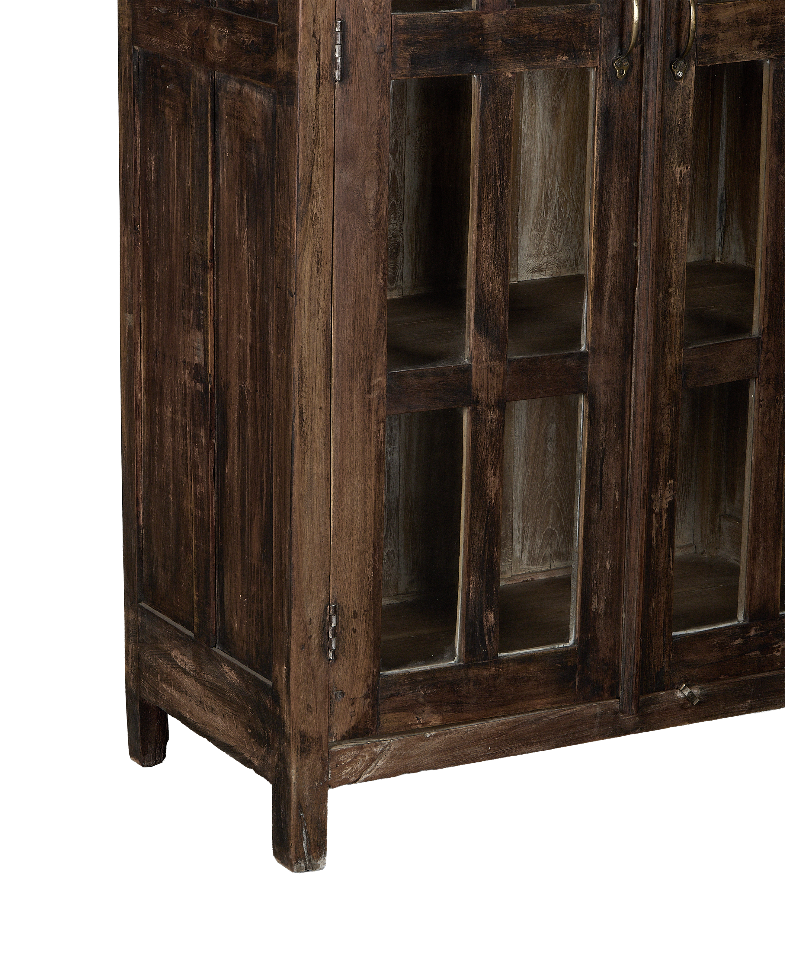 Vintage Indian oak cabinet showcasing glass-front doors, rustic wood texture, and aged brass handles.