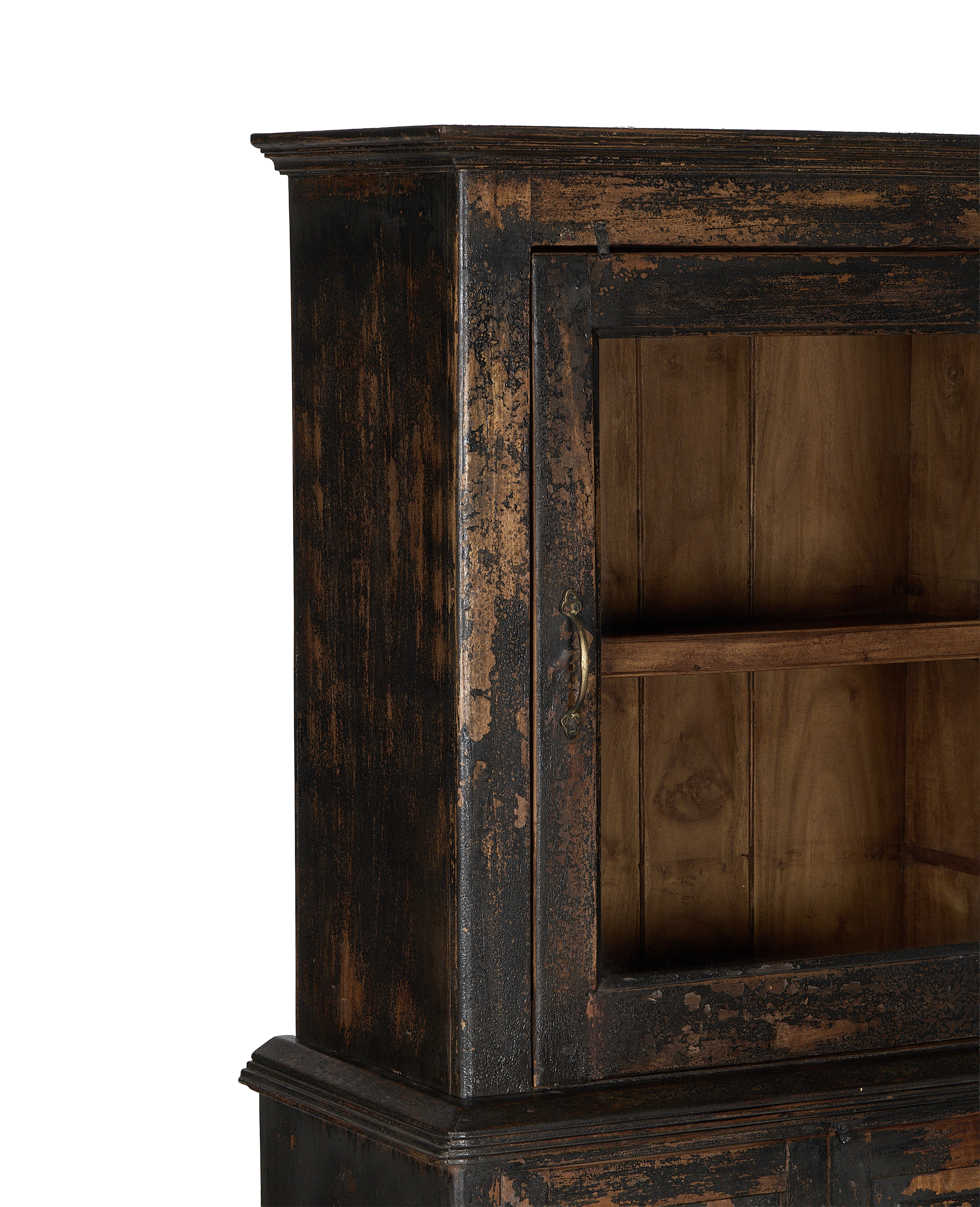 Distressed vintage Indian oak cabinet with partially open door, revealing interior shelves and aged brass handle.