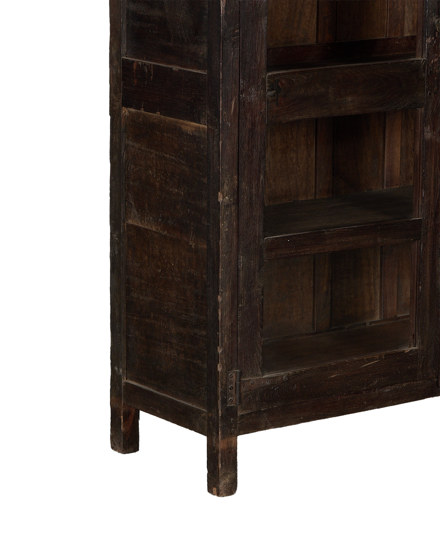 Vintage Indian oak cabinet featuring distressed stained wood, metal hinge details, and lower carved leg.