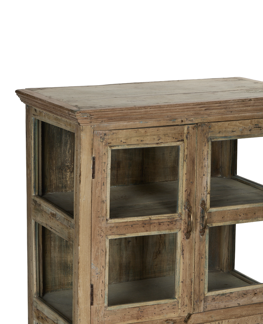Vintage bleached oak cabinet from India, showing detailed glass door, handles, and distressed wood texture.