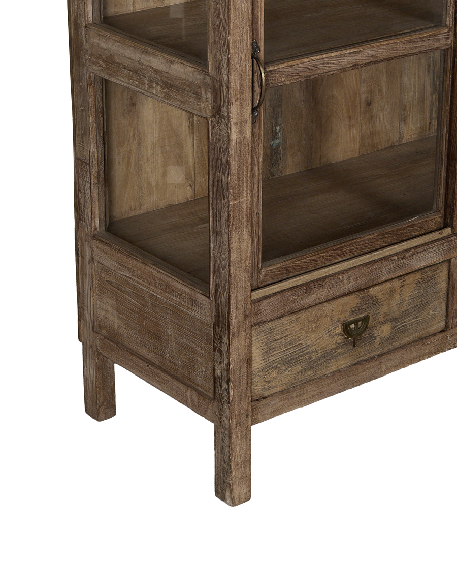 Vintage Indian oak cabinet bottom showing drawer and weathered wood texture.