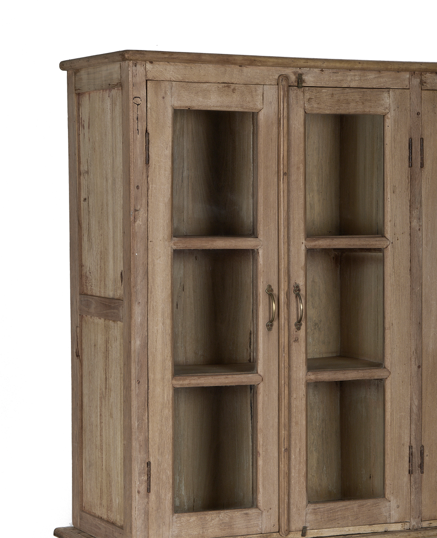 Vintage bleached oak wood cabinet with glass doors and distressed Indian style.