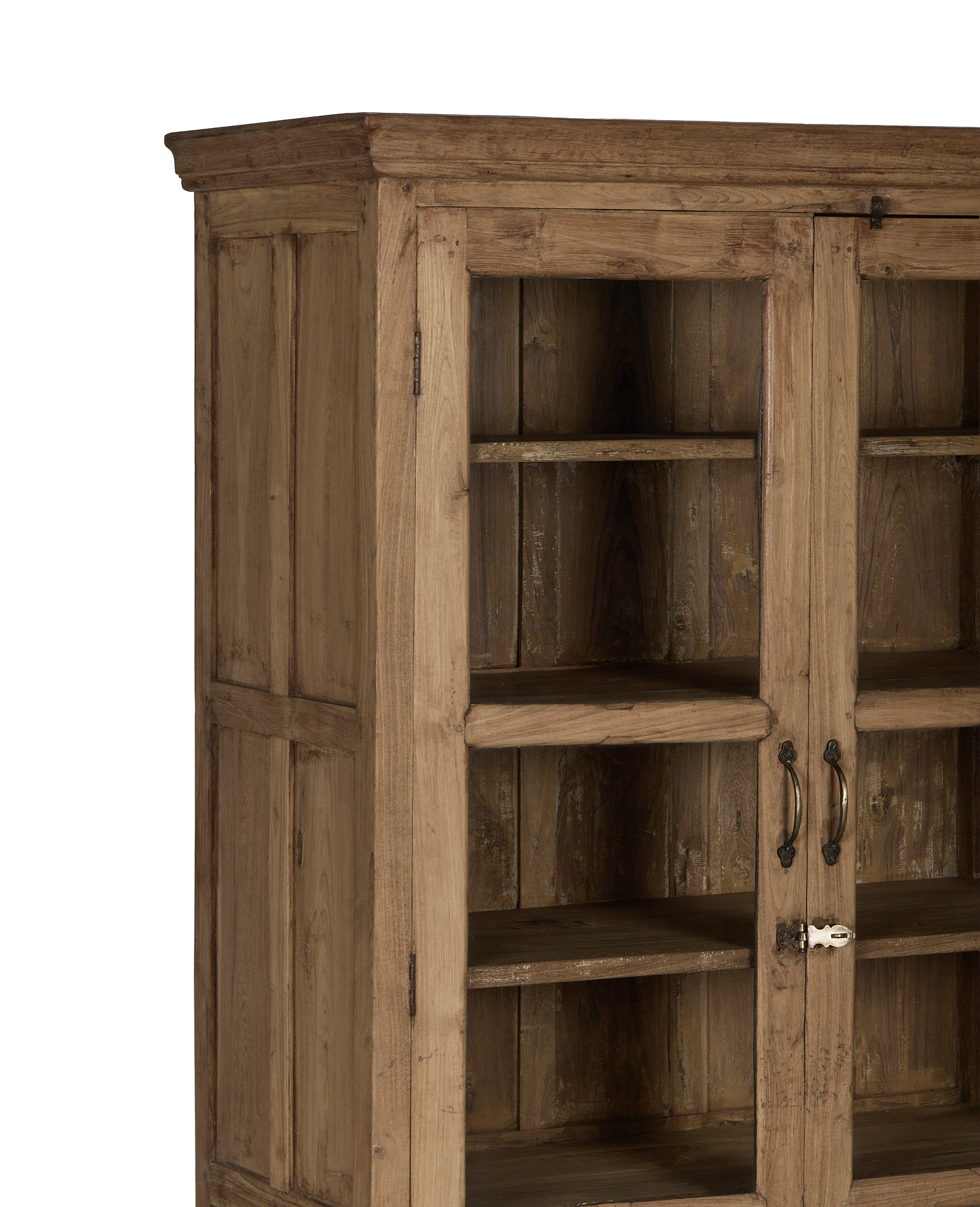 Vintage Indian oak cabinet featuring glass doors, ornate metal handles, and visible wood grain.
