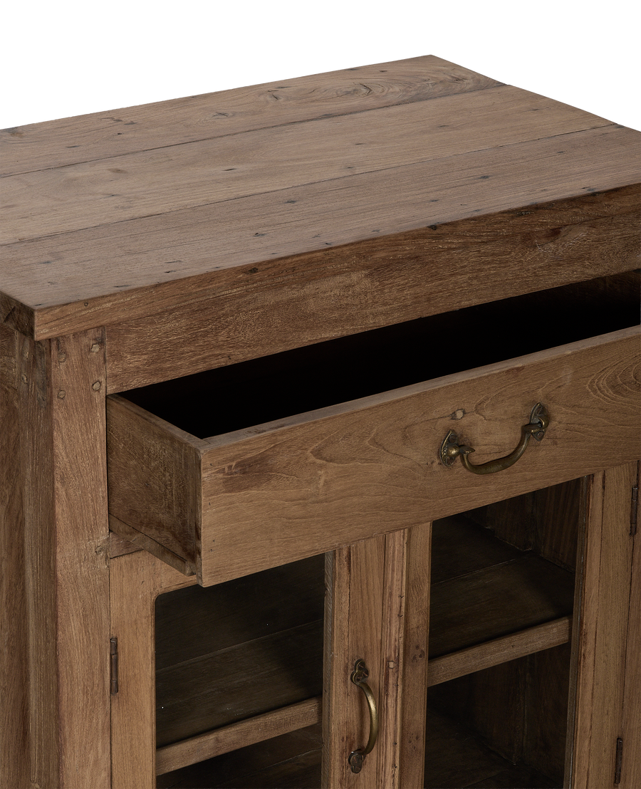 Vintage bleached oak cabinet with open drawer displaying brass hardware, from India.