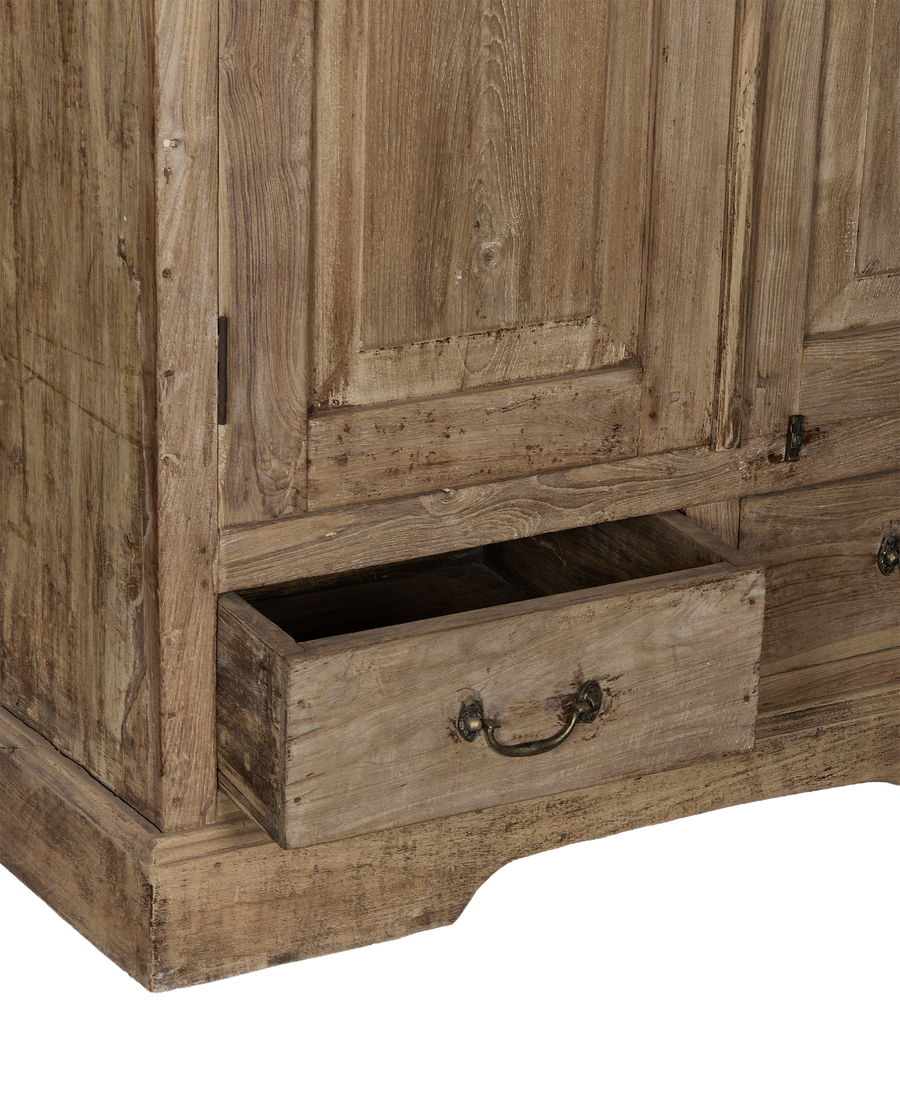 Vintage bleached oak cabinet with an open drawer, showing distressed wood grain and brass pull.